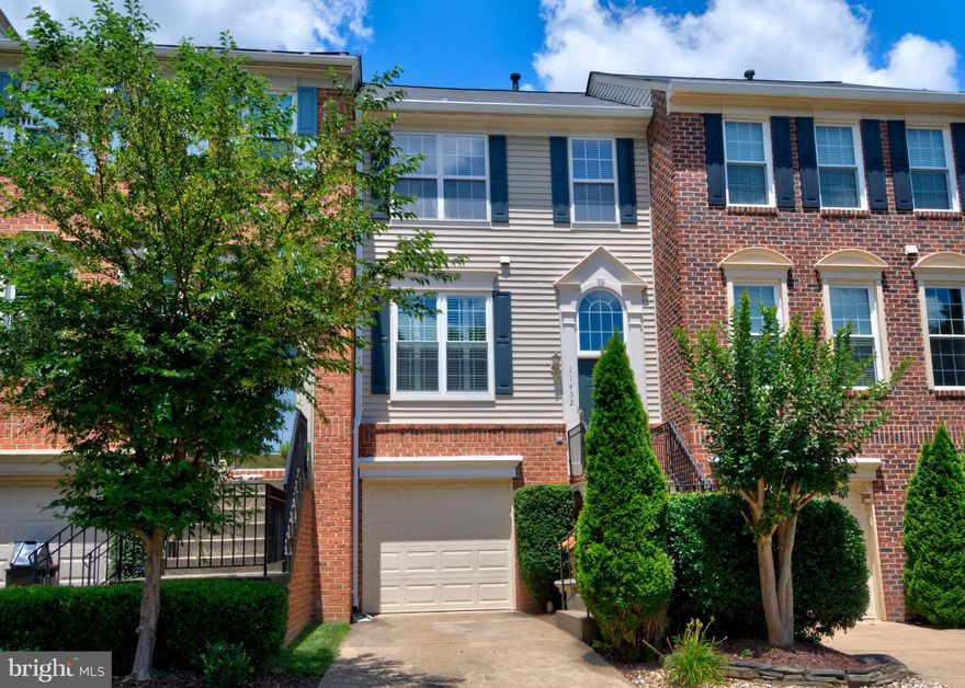 Amazing  3 bedroom, 2 and one-half bath townhouse with one-car garage.   New carpet.  Bamboo flooring.  Luxurious owner's suite with walk-in closet and en-suite bathroom with dual vanities.  Large deck.  Walkout to brick patio.  Office built-ins convey.  Backs to woods.  Bose surround sound conveys.  Close to North Point Shopping Center and Reston Town Center.   Convenient to Route 7.  This one will sell quickly, so, don't hesitate.  Open  house 07/12 from 1pm to 3pm.  Please follow open house instructions to make an appointment to tour.