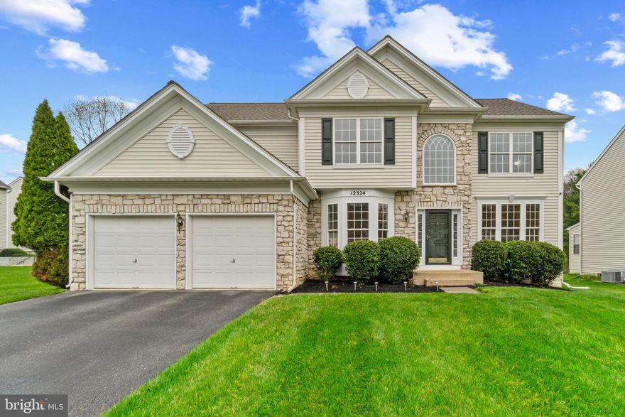 Gorgeous stone-accented Colonial in highly desired Clarks Glen North, beautifully maintained by the original owner and surrounded by meticulously landscaped grounds that enhance its striking curb appeal. Enjoy thoughtful upgrades throughout, including a replaced HVAC system in 2018, a kitchen renovation in 2025, and updates to the main and upper bathrooms in 2023.

Inside, the home showcases a timeless and elegant interior with a traditional yet open floor plan, enriched by refined architectural details. Crown molding and a neutral color palette create a sophisticated atmosphere throughout. Rich hardwood floors extend through the grand foyer, family room, formal living room, and dining room, where wainscoting and bow windows add a touch of charm. A private study with soft carpeting offers a peaceful retreat for work, while a powder room and a laundry room enhance everyday functionality. At the heart of the home, the spacious eat-in kitchen features stainless steel appliances (updated in 2017), ample white cabinetry, a center island with seating, a breakfast bar, a butler’s pantry, a walk-in pantry, and a bright breakfast room with sliding doors that open to the backyard patio—ideal for indoor-outdoor dining and entertaining. Just off the kitchen, the inviting family room impresses with soaring ceilings, hardwood floors, and a cozy gas fireplace.

Upstairs, discover four generously sized carpeted bedrooms and two full bathrooms, including a tranquil owner’s suite with a large walk-in closet, abundant natural light, and a spa-inspired en suite bath with a dual-sink vanity and a jetted soaking tub. The lower level expands the living space with a spacious recreation room, a full bathroom, and walk-out access to the backyard. A dedicated theater room offers the perfect setup for movie nights, while additional storage rooms provide extra convenience. Step outside to a private patio overlooking the spacious and flat backyard—an ideal spot to relax and enjoy the peaceful surroundings of this exceptional home in one of Clarksville’s most sought-after neighborhoods.