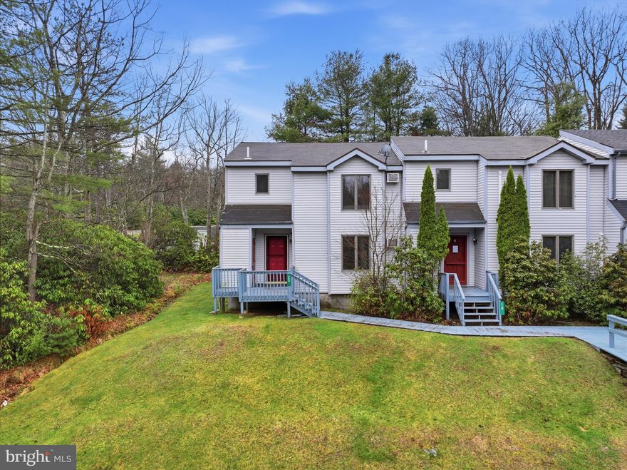 Spacious ski-style townhome near Big Boulder and  Jack Frost ski areas offers an ideal trifecta of real estate opportunity. Unlock investment potential with this versatile end-unit Harmony Ridge townhome in Lake Harmony. This spacious 1,754-square-foot property offers a prime opportunity for investors targeting strong returns in a popular rental market. With a larger floor plan than other townhome-style homes in the area, it stands out as an attractive investment vehicle. Envision a high-value, modern rental, a desirable mountain retreat for the rental market, or a second home with consistent income potential—the property adapts to multiple investment strategies. The recently updated kitchen reduces renovation costs and improves rental appeal, while generously sized rooms and ample storage increase tenant satisfaction and value. Benefit from the ongoing demand for rentals in this high-activity, year-round market. The included community pool and proximity to recreational activities strengthen rental growth potential. Strategic elements like the first-floor outdoor ski closet and wide entry foyer with laundry simplify property management, and the multiple-bedroom layout maximizes income from group bookings. Upstairs, a loft with a dry bar and a primary suite with deluxe bath features cater to renters seeking quality accommodations, supporting stable occupancy and competitive pricing. The home is ready for your enjoyment right away-bring your suitcase and your vacation plans!