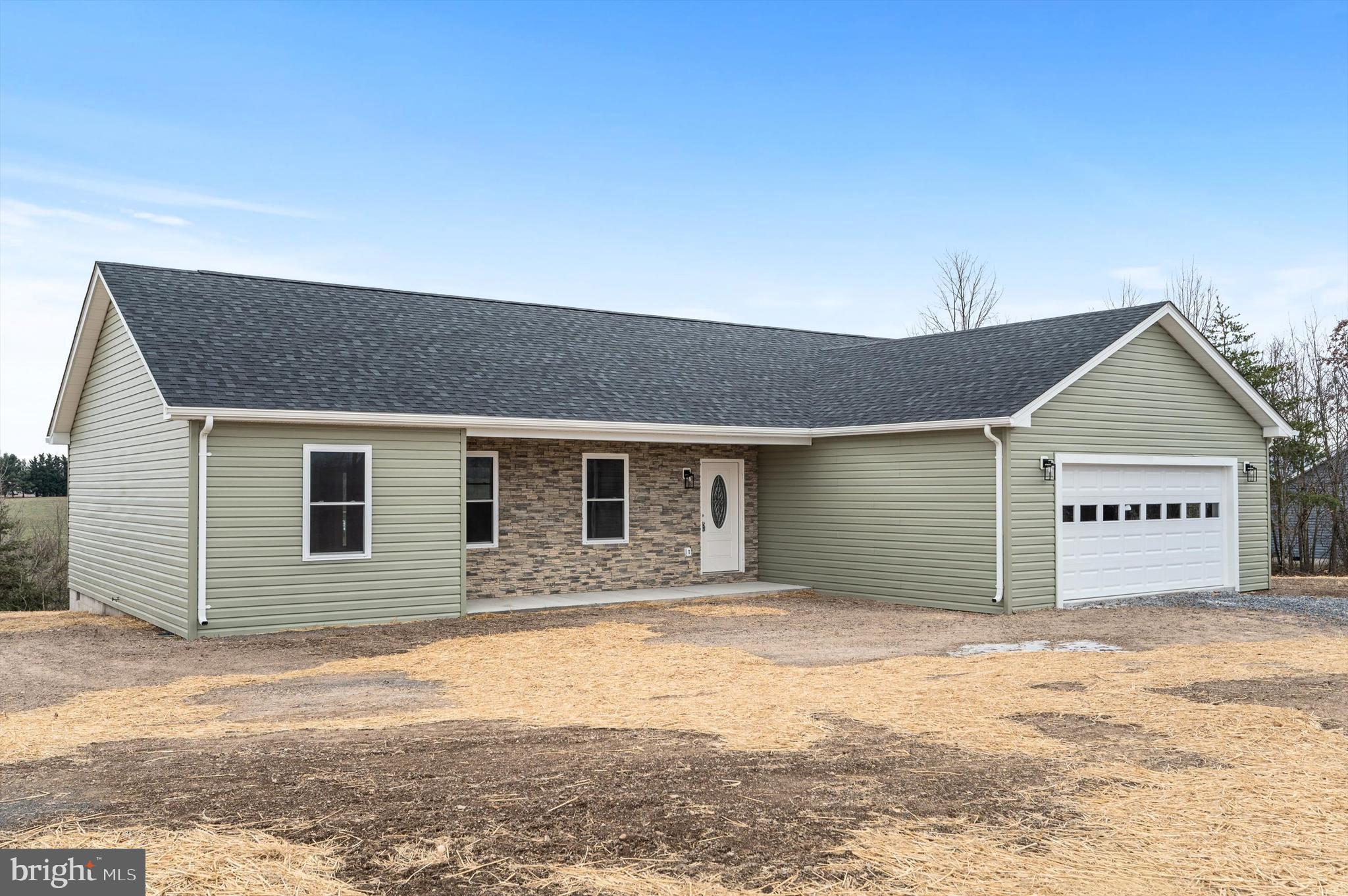 *** COMPLETE AND SUPER AFFORDABLE 1,650 SQ FT SPACIOUS RANCHER ON OVER 2 ACRES … JUST OVER VA LINE AND NO HOA!*** Located in a small, rural subdivision called Mohrs Landing and just 20 minutes from Winchester, this is the one level NEW CONSTRUCTION living that you’ve been waiting for! This split bedroom plan is finished in a neutral palette of white kitchen cabinetry, stainless steel appliances, luxury vinyl planking THROUGHOUT home including bedrooms and baths. Nice sized decking off rear overlooks gorgeous mountain vistas and level 2-acre lot. PART OF POND IS LOCATED IN REAR OF PROPERTY FOR GREAT ACCESS! Front covered porch area allows for relaxing front porch sitting. Large 2 car garage has an additional finished room for storage. Laundry room is conveniently located off garage and primary bedroom. This new home will be a great starter or perfect home for downsizing! You won’t be disappointed by the great quality this home has to offer, as well as a 1-year builder's warranty offered by Signature Homes of WV, Builder.