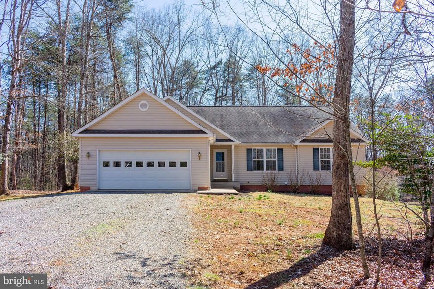 Discover this charming one-level home featuring 3 bedrooms and 2 baths with 1,759 finished sq. ft. and a full unfinished walk-out basement with a rough-in for a future bath. Designed for comfortable living, this home boasts an open floor plan with a gas fireplace in the living room, a living-dining combo, and a spacious kitchen with a huge walk-in pantry. Enjoy outdoor living on the large rear deck or relax on the covered front porch overlooking the nice level yard, which offers a mix of open space and mature trees for added privacy. The front-loading 2-car garage provides convenience, while the home's private road location at the end of a cul-de-sac ensures peace and tranquility. This home is centrally located just minutes from Route 20, offering easy access to nearby amenities. Don’t miss this opportunity to own a beautiful home in a serene setting! Enjoy the best of Orange County with local vineyards, breweries, historical sites, and more just minutes away.