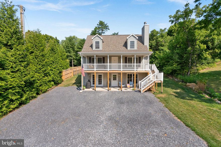 Welcome to 18291 Clayton Hall Road in the serene community of Bluemont, VA 20135 in Loudoun County. 
This stunning Cape Cod-style Chalet home, built by Nicholls, is just one year young and ready for you to make it your own. The current owners are relocating for work, which means their meticulous efforts in creating a perfect home are now yours to enjoy. With 3 bedrooms, 2 bathrooms, and 3 levels of thoughtfully designed living space, this property offers both comfort and convenience.

Step inside to be greeted by a warm and inviting open concert family room, which serves as the heart of the home. The modern kitchen with stainless steel appliances,  flows seamlessly into the family room, where a wood burning fireplace creates a cozy ambiance. This level also features two generously sized bedrooms, a full bathroom, and a shared laundry space, making daily living a breeze. The kitchen opens up to a private wooded backyard, perfect for enjoying nature in your own sanctuary.
The upper level owners retreat features the primary BR/BA and walk-in closet. 
The exterior of this beautiful property is equally impressive. A long 6-car bluestone driveway welcomes you home to a ½ acre fully fenced backyard, ideal for both pets and outdoor activities. Enjoy the picturesque front-facing ground level patio or relax on the spacious front porch, designed for swinging and evening fires as you watch the tranquil country road. All systems in the home are new and come with warranties that will be conveyed to the new owners. This home is truly move-in ready and waiting for you to start your next chapter.
