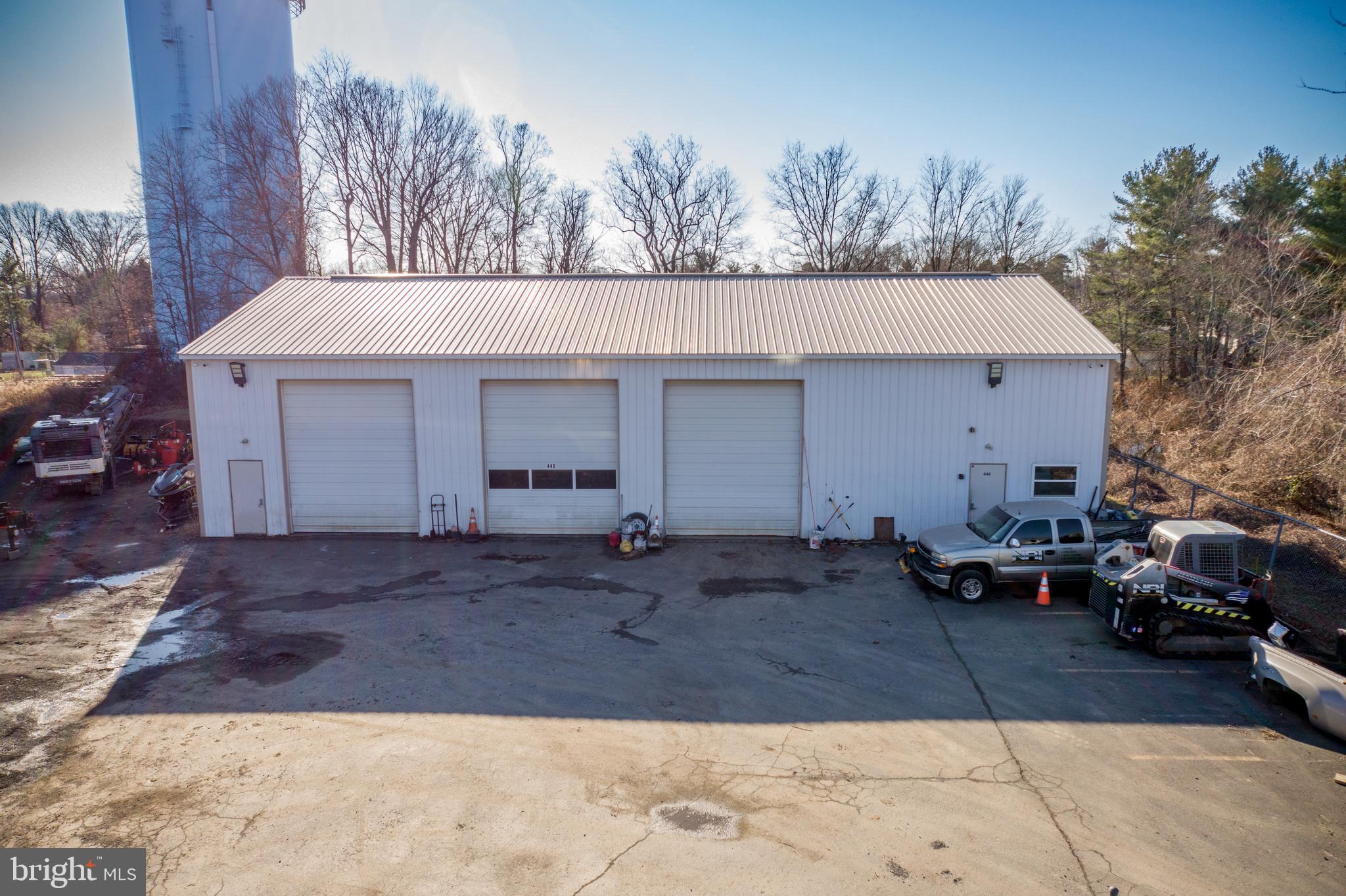 *Owner financing available to qualified buyer* **30% DOWN PAYMENT**
Contractor’s Dream Facility – 440 Veit Rd, Huntingdon Valley, PA
This 3,200 sq. ft. commercial contractor facility in Lower Southampton Township is a rare find, offering everything you need to take your business to the next level. Located at the end of a quiet cul-de-sac in a well-kept industrial park, this property is thoughtfully designed with convenience, functionality, and security in mind.
Key Features Include:
Public utilities: Public water, sewer, and underground electric for efficient operations.
Three oversized bays: Perfect for storing vehicles, tools, and equipment, each with air compressor lines for quick tire maintenance.
Heated bathroom with utility sink: Enjoy year-round comfort with a heated restroom and a utility sink for added convenience.
Integrated fire safety system: Smoke and fire alarms wired directly to the fire department provide enhanced safety and peace of mind.
Working security system: Stay protected with a fully operational security system to safeguard your property and equipment.
Prime accessibility: Located on a clear road, making travel to and from construction sites safe and easy.
Ample storage: Stop renting and gain the space you need for all your business essentials.
The owner’s attention to detail has created a move-in-ready facility designed to meet the needs of contractors. It is zoned I (industrial)) in Lower Southampton Twp, which allows for many other uses. Conveniently situated in Huntingdon Valley, this property offers excellent access to the surrounding area while ensuring a safe and efficient workspace.
Please note the retention basin takes up about half of this property. Basin potentially has use, must talk with Lower Southampton Twp about filling in.
Don’t miss this incredible opportunity—schedule your tour today and see how this property can support your business goals!
3 Bay Garage Available for Sale or Rent.
A- 20x40 OWNER WILL OCCUPY
B- 20X40 Available for $2400/month
C- 40x40 Including 10x10 bathroom Available $2900/month.
If tenant would like both bays it would be discounted to $4800/month.
Rent can be either month to month or 18 month lease and then month to month if tenant desires. First month, Last month and 1 month security is necessary. Acceptance is subject to standard credit check.