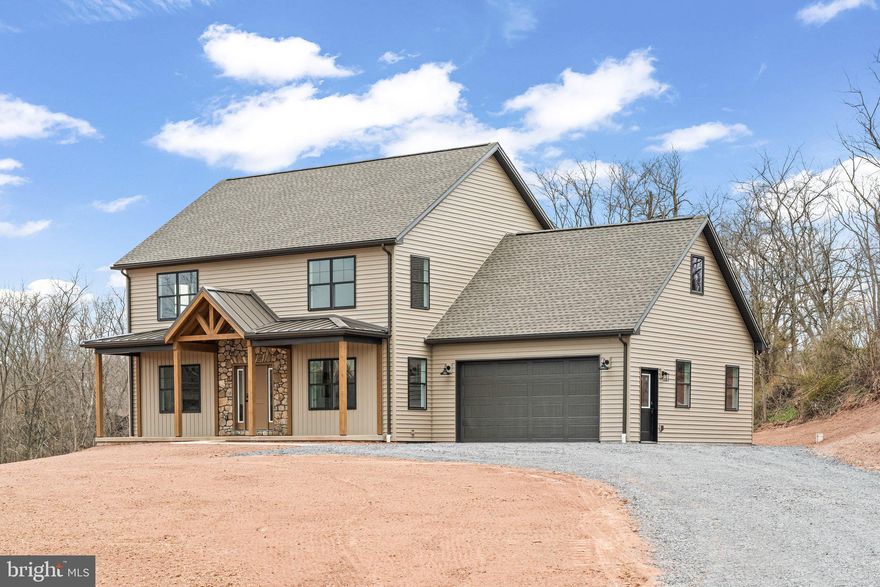 Discover this beautifully crafted two-story home, offering 2,306 sq. ft. of thoughtfully designed living space in a tranquil, wooded setting. Featuring 3 bedrooms and 2.5 bathrooms, this brand new home seamlessly blends modern comfort with peaceful country living. The main level boasts a custom kitchen with granite countertops, a spacious dining area, and a cozy living room with a gas fireplace. A large office provides the perfect space for remote work or study. Upstairs there are 3 bedrooms, two bathrooms, a centrally located laundry area, as well as access to the bonus room above the attached garage. The full basement and bonus room offers plenty of additional storage or potential living space. Step outside to a generous back deck, ideal for entertaining or simply enjoying the serenity of nature. Located just minutes from US 322/22 and Newport Plaza, this home offers the perfect balance of convenience and seclusion. Schedule your private tour today!