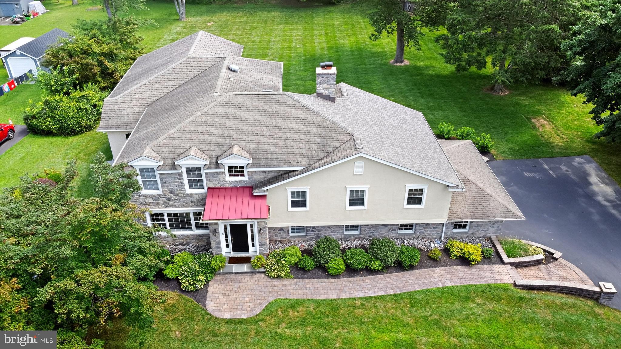 Set on a private and picturesque .93-acre lot, this exceptional 5-bedroom, 3.5-bath residence offers over 4,300 square feet of refined living space and an extraordinary connection to nature. Bordering the iconic Tyler Arboretum—a breathtaking 650-acre sanctuary with over 20 miles of walking trails—this home provides a rare opportunity to enjoy a tranquil lifestyle without sacrificing convenience. Located just 16 miles to Center City Philadelphia, 20 miles to Wilmington, Delaware, and only 20 minutes to Philadelphia International Airport, the best of both worlds awaits.
Step inside to discover a warm and welcoming open-concept layout thoughtfully designed for both everyday living and elegant entertaining. At the heart of the home is a chef’s kitchen with premium appliances, abundant cabinetry, and an oversized center island. The kitchen flows seamlessly into the sunlit breakfast area and inviting family room with a gas fireplace—an effortless blend of comfort and sophistication. French doors open to an expansive rear patio that invites outdoor dining and peaceful views of the lush, arboretum-adjacent backyard.
The second floor features three spacious bedrooms, including a private en-suite, as well as a cozy office nook ideal for remote work or study. The third level offers yet another flexible workspace or lounge, a fourth bedroom, and the exquisite primary suite—a true retreat featuring a luxurious spa-inspired bath and an expansive walk-in closet.
The lower level includes a second family room, an adorable and efficient laundry area, and a stylish powder room—offering additional living space for casual gatherings or relaxation. A full, unfinished walkout basement provides abundant storage or the potential for future customization.
Enjoy unparalleled access to Ridley Creek State Park, just a half-mile from your doorstep, offering 2,606 acres of protected woodlands, a 5-mile paved multi-use trail, and year-round trout fishing.
This residence is ideal for the family seeking room to grow, work, and unwind—all in a premier natural setting rarely found in today's market. All stucco has been thoroughly tested with excellent results.