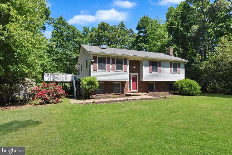 Nestled in the serene countryside of Lusby, this private, four-bedroom, three-bath home sits on a square acre, surrounded by mature trees and offering unparalleled privacy. Just minutes from the Patuxent River, this home is a dream for nature lovers, with access to boating, fishing, and outdoor adventures. The large lot is bordered by a 100-acre park like property, ensuring quiet, wooded views. A winding, private driveway leads you home, where spacious living areas and modern finishes await. Enjoy the best of both worlds: a peaceful retreat, just a short drive from the Pax River, local parks, and all the charm of Southern Maryland.