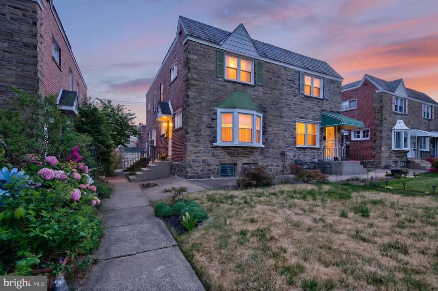 Welcome to this well‑maintained three‑bedroom, two‑bath twin home, lovingly owned by the same family for over 60 years. The main level features a spacious living room, formal dining room, and an eat‑in kitchen with abundant natural light. The partially finished basement offers additional living space and includes a full bathroom. Beautiful landscaped gardens surround the property, enhancing curb appeal and outdoor enjoyment. Conveniently located near shopping, schools, and public transportation, with ample street parking. A solid, cared‑for home with great potential for its next owner.