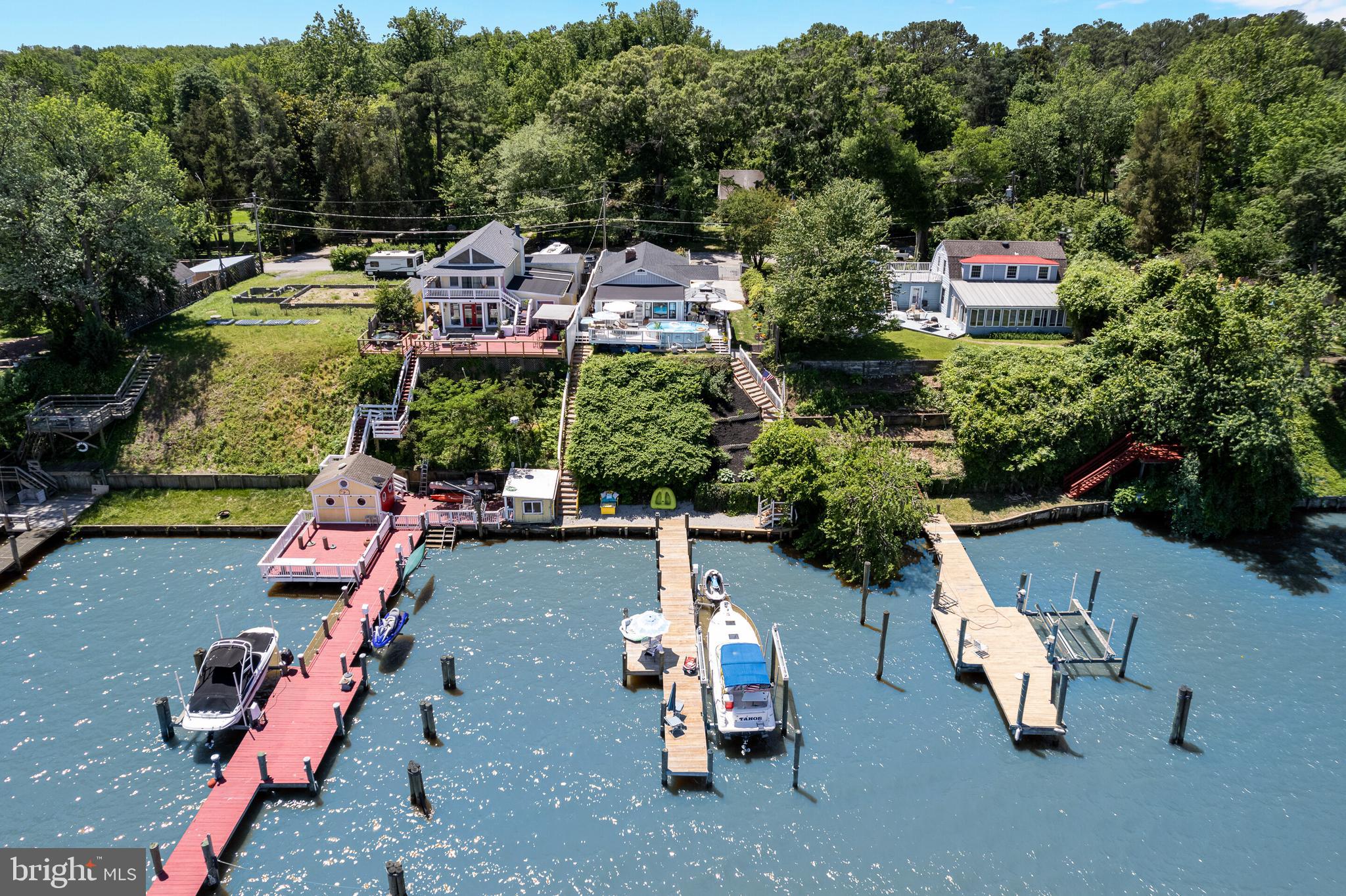 Potomac River Frontage at Gunston Manor! Rare Find and First Offering of Riverfront Home! Features outdoor living spaces including Decks, Gazebo, walk ways, court yard, Pier with Boat Lift, jet ski lift, sundeck, and more. Interior spaces with amazing views! First floor main entry from covered deck area to foyer off Living area and Kitchen, Bedroom and Full Bath on main level, great room with amazing views. Stairs to lower lever with additional full bath and Bedroom plus kitchen area and walkup stairway exit. Charming home with accessory features too many to list. This is a must see property offering in a wonderful River Front location.
Minutes form US Route one and I 95 yet a world away from the trappings of the metro area. You will enjoy the rural nature of the area as soon as you turn onto Gunston Road on your drive to the River.