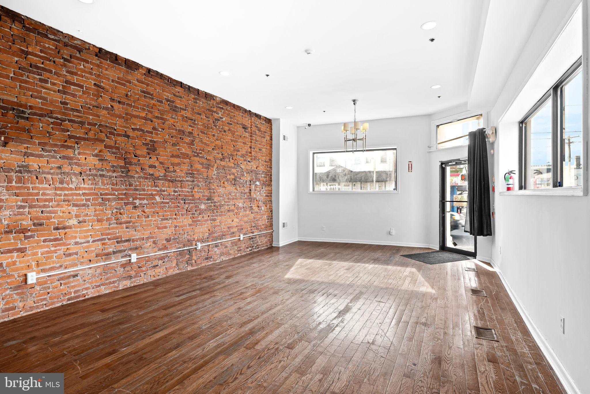 Welcome to your booming business' new location! Awesome corner store opportunity with a huge finished basement in this very busy expanding neighborhood right on Frankford Ave. This store front has tons of natural sunlight throughout and a full finished basement with a full bathroom for plenty of storage or office use. This open floorpan storefront has very high ceilings too. Take the bus on Frankford Ave or walk to the EL train to get around town. There are dozens of shops and now bars close by as well in the exciting Harrowgate area. Make an appointment to check out this awesome unit today! Use it as a bi-level multi desk office, corner shop, or whatever your needs are.