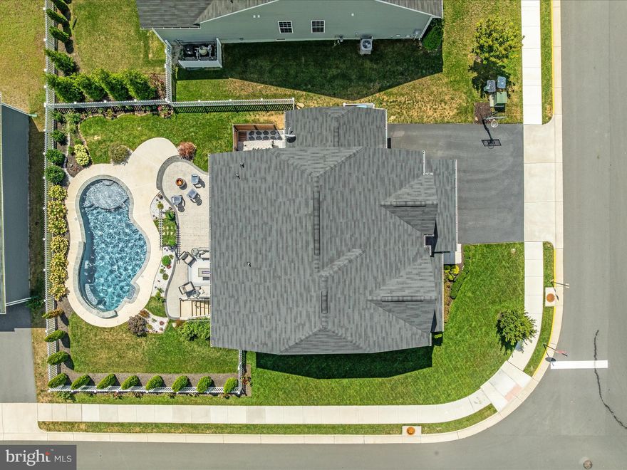 Welcome to this beautifully appointed 5-bedroom, 3.5-bath home in the highly desirable Snowden Bridge community of Stephenson, VA. Nestled on a premium corner lot, this home seamlessly combines modern design, thoughtful upgrades, and exceptional outdoor living spaces, creating an ideal setting for both everyday living and entertaining.

The main level features an inviting open-concept layout with defined yet connected spaces. A private home office offers a quiet retreat for working from home, while the formal dining room sets the stage for gatherings. The spacious family room flows effortlessly into the chef’s kitchen, where you’ll find updated appliances, custom-built cabinetry, a large pantry, and an adjoining mudroom with additional built-ins—providing both function and style.

Upstairs, four generously sized bedrooms and two full baths provide comfortable accommodations. The highlight of the upper level is the custom-designed laundry room, complete with cabinetry and workspace, making household tasks efficient and organized.

The fully finished lower level expands your living options with a legal bedroom, full bathroom, large recreation room, and abundant storage space. Whether used for guests, multi-generational living, or entertaining, this level offers remarkable flexibility.

Outdoor living is truly exceptional. Step outside to enjoy your private backyard oasis, featuring a custom heated in-ground pool with waterfalls, a sundeck with a bubbler, an expansive patio, and professionally designed landscaping accented by exterior lighting. This outdoor retreat is perfect for summer relaxation, weekend entertaining, or evening gatherings under the stars.

Practicality meets convenience with a 3-car garage and an oversized driveway that can easily accommodate up to 8 vehicles, ensuring plenty of space for family and guests.

Living in Snowden Bridge means access to a wealth of amenities designed to enrich daily life. The community features a 15,000 sq. ft. sportsplex with indoor courts, a resort-style outdoor pool with a giant slide, walking and biking trails, playgrounds, a dog park, picnic areas, and a paved bike racetrack for children. Residents also benefit from an on-site elementary school and daycare, as well as year-round community events.

Just minutes from shopping and dining at Rutherford Crossing and the charm of Historic Downtown Winchester, Snowden Bridge also offers easy access to I-81 and Route 7, making commuting simple and convenient. With the Shenandoah Valley’s outdoor recreation, wineries, and scenic trails nearby, this location combines small-town comfort with regional attractions.

This home is the perfect blend of luxury, convenience, and community lifestyle—ready to welcome its next owner.