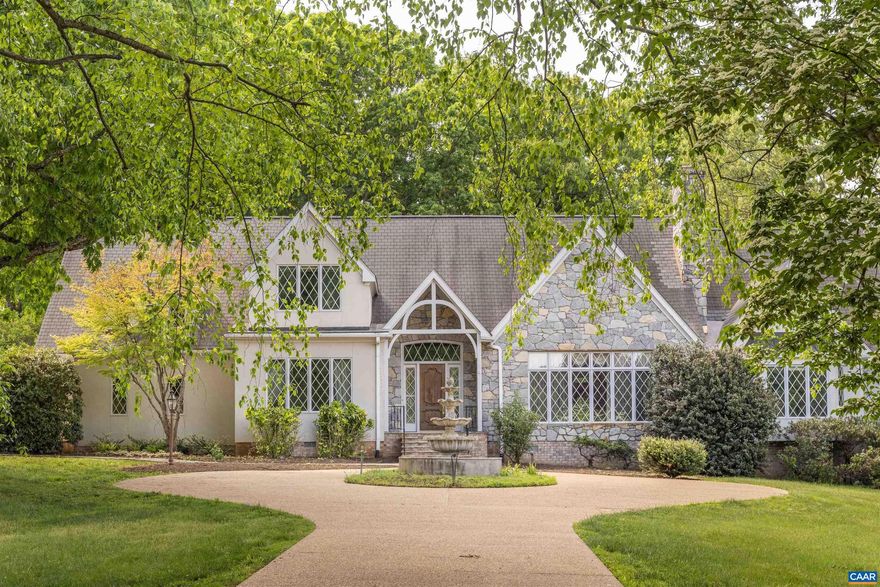 Situated on nearly 7.5 manicured acres amongst the scenic & rolling terrain of Western Albemarle ,on the highly coveted Garth Road,  is this stunning, completely custom English Country-style residence  only 5 miles from town! Designed & constructed with premium finishes & unparalleled attention to detail, the stone & stucco home features an extremely functional and inviting, light-filled floor plan, cathedral ceilings, elegant moldings, striking stone fireplace, with custom built-ins throughout. There is a large primary bedroom suite on the main level along with an adjoining second bedroom suite.  Upper level has a 3rd bedroom, full bath, office or study, and huge loft area to covert a 4th bedroom, and  family room. Other features include three bay garage,  and generous well-appointed kitchen w/ adjoining breakfast room, leading to covered exterior porch. The surrounding grounds offer a  truly lovely setting, with gorgeous landscaping, towering oak trees , large goldfish pond and magnificent views of the surrounding pastoral countryside. PRICED TO SELL, LISTED ALMOST $200,000 BELOW CURRENT ALBEMARLE CO. TAX ASSESSMENT!!!,Granite Counter,Solid Surface Counter,White Cabinets,Wood Cabinets,Fireplace in Great Room