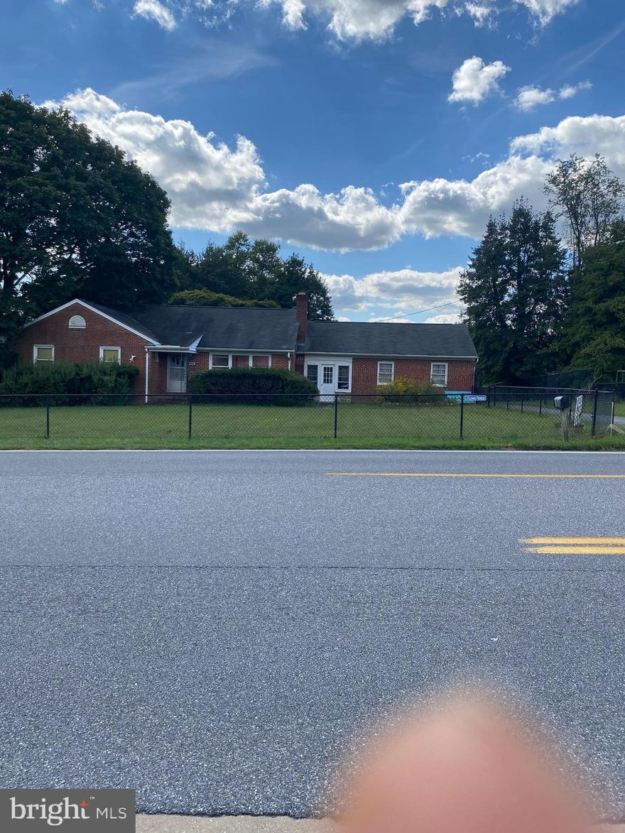 Solidly built brick rancher on nearly an acre.  This home offer large rooms all with hardwood floors, semi -open floor plan, large unfinished basement with plenty of potential. The over sized two car garage has plenty of space for tools as well as your vehicles.  A little TLC would make this a great home. Sold As is.  Pls call agent for appointment confirmation.