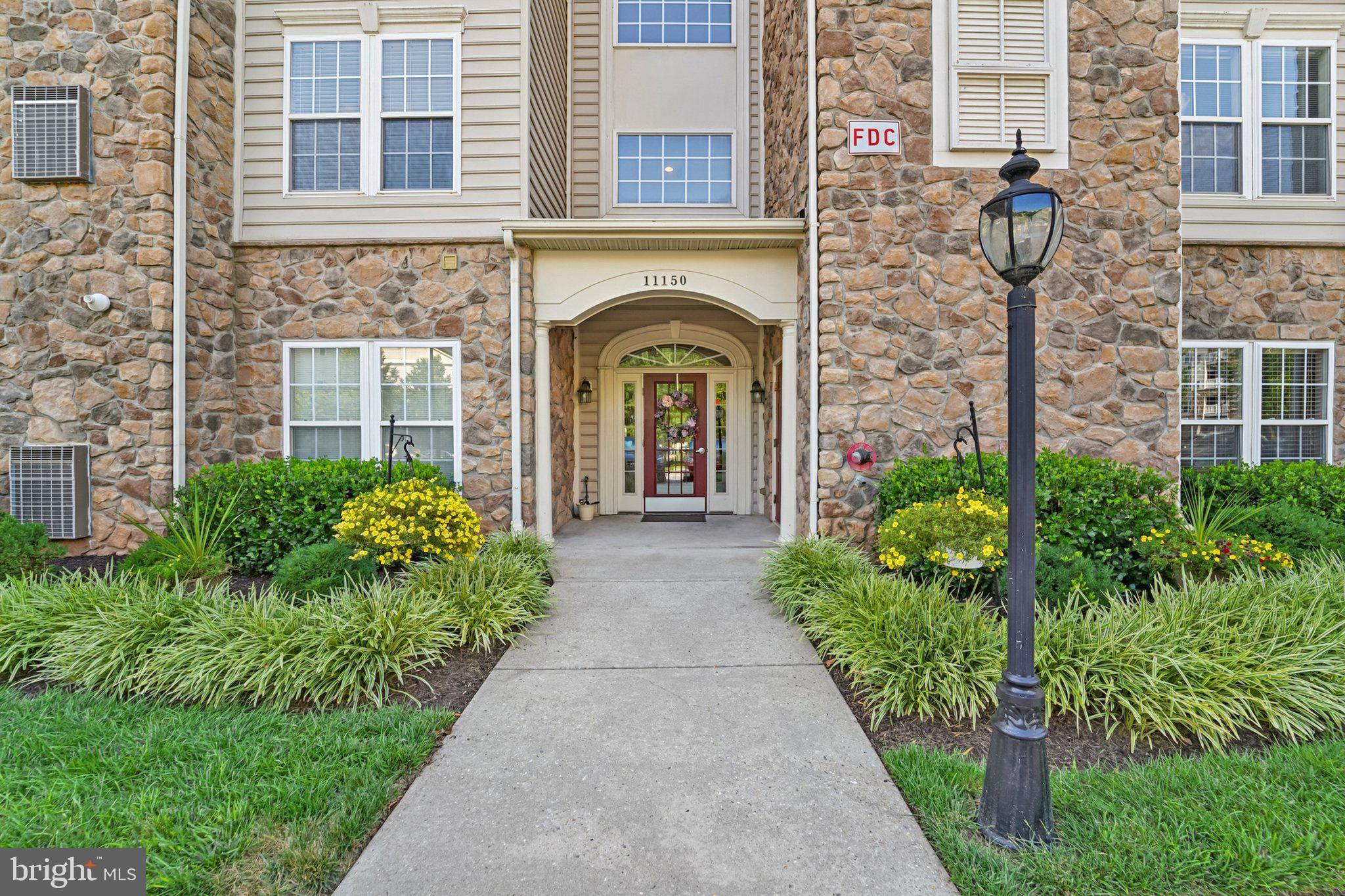Welcome to Waverly Woods—a 55 and over community! Comfort Meets Convenience!
Step into this bright and spacious condo that feels like home the moment you arrive. From the gleaming hardwood floors in the foyer to the crown molding in the living room, dining room, and foyer, every detail is designed to impress. The sun-drenched living room features a cozy gas fireplace with a stunning stone surround and a wall of windows that flood the space with natural light.
The kitchen is both stylish and functional, complete with sleek black appliances, an electric range, a classic porcelain double sink, corian countertops, and ample space for a kitchen table. Whether working from home or hosting dinner, the dedicated dining room provides flexible space to suit your lifestyle. Enjoy the convenience of an in-unit washer and dryer, along with ample storage in a large hall closet. The second bedroom features a ceiling fan and a generous double-door closet, and the adjacent hall bath has its own linen closet. It is perfect for guests or a home office.
Retreat to your oversized primary suite, where you'll find a massive walk-in closet and a bump-out perfect for a reading nook or work area. Additionally, the luxurious en-suite bath features a linen closet, a high double vanity, modern finishes, and a step-in shower with a grab bar and shower seat.
Step outside to your private balcony and enjoy peace of mind with a recently updated HVAC system.
All this in a wonderful community that includes access to two pools, one a family-friendly pool, a tot lot, and gazebos spaced throughout the community, perfect for enjoying warm days and socializing with neighbors. Spacious. Stylish. Move-in Ready. Don’t miss your chance to make this beautiful condo your new home!