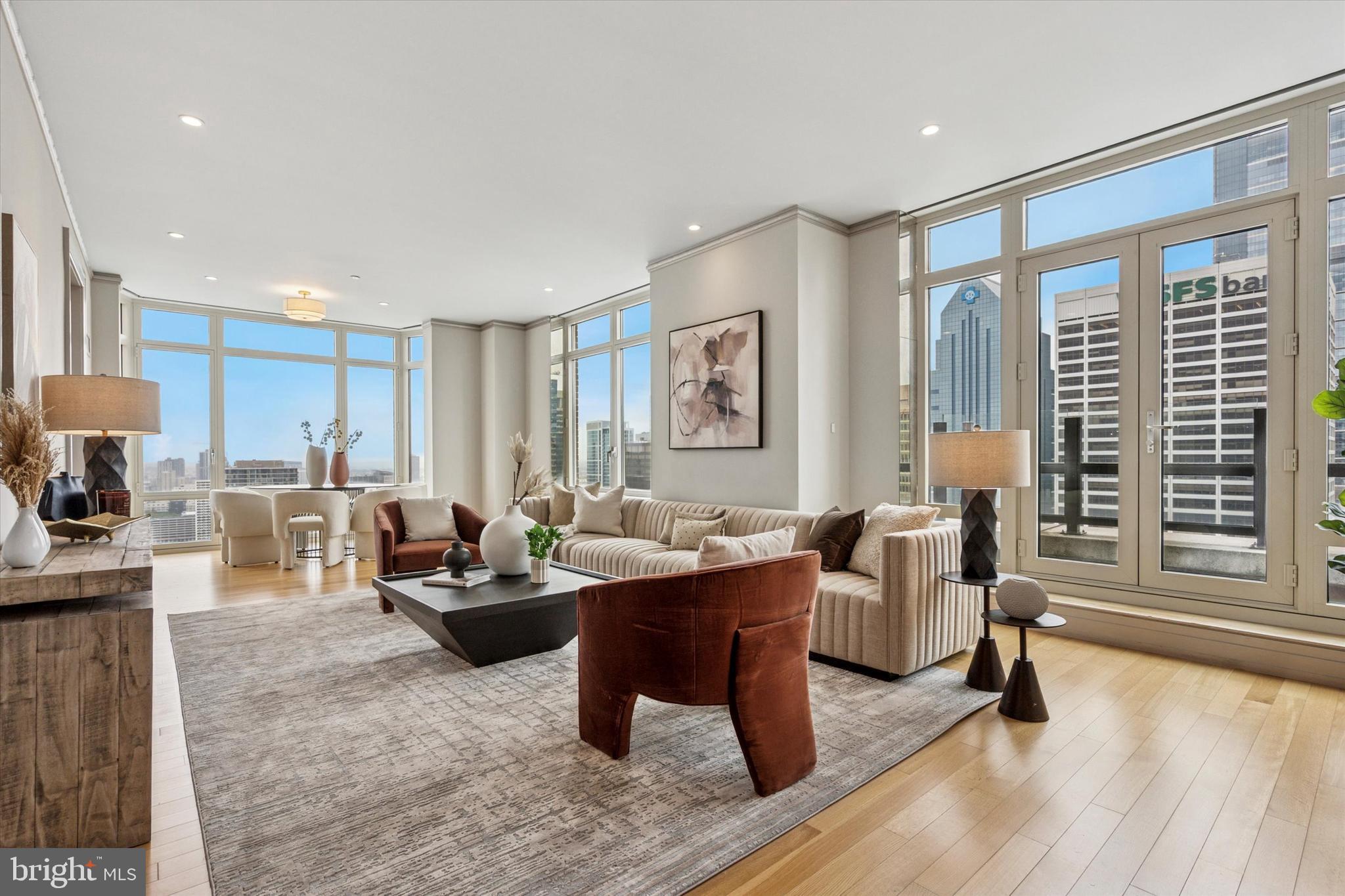 Presenting a spectacular 2-bedroom, 2.5-bath penthouse residence spanning over 2,400 square feet at 10 Rittenhouse Square, offering unmatched elegance, panoramic views, and world-class luxury in one of Philadelphia’s most coveted addresses. Freshly painted throughout with newly installed light fixtures, this extraordinary home is filled with natural light from soaring ceilings and dramatic floor-to-ceiling windows, showcasing sweeping city and park vistas that truly bring the outdoors in.
At the heart of the home is a meticulously designed Joanne Hudson kitchen with Downsview cabinetry, a spacious island, and seating for six, making it ideal for both everyday living and entertaining. The expansive living room is a showpiece, highlighted by its wall of glass that frames stunning skyline views, flooding the space with natural light by day and offering a glittering backdrop of city lights by night. Double glass doors open to a Juliette balcony, and the seamless flow into the formal dining area makes it the perfect setting to take in magnificent sunsets.
The double-sized primary suite is a private retreat with high ceilings, a sitting area, two large walk-in closets, and a luxurious ensuite marble bathroom. A generous second bedroom completed with an ensuite bathroom provides the perfect space for guests or a home office.
10 Rittenhouse, designed by Robert A.M. Stern, offers premier services and amenities, including concierge, 24-hour security, doormen, underground parking, and world-class resident facilities: a newly updated fitness center, indoor swimming pool, spa, sauna, landscaped terrace, meeting and conference rooms, and extra storage. The monthly fee covers common area maintenance, exterior building maintenance, gas, water, sewer, trash, snow removal, pool access, and the health club.
Perfectly situated on Rittenhouse Square, residents enjoy acclaimed restaurants, boutique shopping, cultural institutions, theaters, museums, a weekly farmers market, and the lush greenery of the Square right at your doorstep.