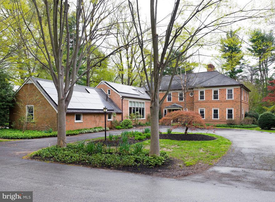 Words alone cannot describe the incredible charm and elegance of this attractively updated colonial in prime Bryn Mawr. You must come experience it! A stately tree-line entrance invokes a feeling of privacy and enchantment as you approach, with 2 driveways including a large circular drive and 3-car garage providing ample parking for family and guests. The setting is scenic and serene, with lush trees and plantings, and expansive lawn for kids and pets, overlooked by spacious covered and uncovered patios for entertaining. The beautiful outdoors is complemented by exceptional interiors affording comfort for any occasion, whether you want together or alone time, also perfect for post-COVID living with everything you need, from dual offices to recreation and workout space.  Well-built and designed, featuring generous rooms and a gracious layout, this handsome home has been thoughtfully updated over the years with replaced windows, refinished wood floors, redone kitchen & bathrooms, a mudroom addition, recently renovated family room with 2 stories of light, upstairs lounge renovation for teens & relaxation, a renovated workout area in the finished basement, even a new water heater and solar installation. An airy entry hall with turned staircase welcomes you inside introducing a seamless flow between rooms. Wood-burning fireplaces enrich the expansive living room, family room with a window wall & built-in cabinets and one of the offices on the main level. Host dinner parties and celebrate holidays in the graciously-proportioned dining room, connected to a lovely eat-in kitchen with an island, walk-in pantry & built-in banquette. Conveniently nearby is a powder room, rear staircase & mudroom with garage access. Completing the main level is a peaceful bedroom with full bath, now being used as a second office.   Upstairs sleeping quarters offer an inviting place to unwind, with 4 sizable bedrooms, 2 en-suite bathrooms, a full hall bath, laundry room with bath, and a bonus room/lounge. The primary bedroom presents a big walk-in closet and luxurious spa-bath oasis with his & her vanities, a double glass-enclosed shower & soothing soaking tub. The finished basement extends the living with a game room, exercise room, built-ins & tons of storage. Plus you’ll enjoy central air, a security system, in-ground lawn irrigation, electric pet fence, and an incredible location topping it all – close to great Main Line towns (Ardmore, Bryn Mawr, Wayne, etc., the Bryn Mawr train station (direct to downtown via SEPTA & Rte. 76!