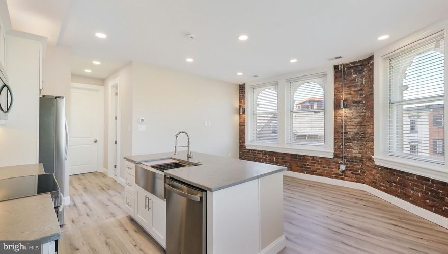 Welcome to this luxury Doylestown Borough apartment! Having undergone a complete renovation in 2020, this spacious one bedroom apartment is beautifully appointed with a fully equipped kitchen that includes a generous sized center island with granite top, stainless steel appliances, tiled back splash, white shaker cabinets and accent lighting. The living space features exposed brick walls, high ceilings and an abundance of natural light. The full bathroom is incredible with a glass enclosed rain shower with custom tile accents, modern vanity and fixtures. The large bedroom features a double closet. Convenient in-unit laundry is included. Added details throughout highlight the clean modern design mixed with the rustic character of this century old building. Located in the heart of the borough with shopping, restaurants, museums, and the train station just steps away. This secured building is well maintained and offers a keyed entrance, security cameras and most importantly, a one of a kind apartment to call your own.