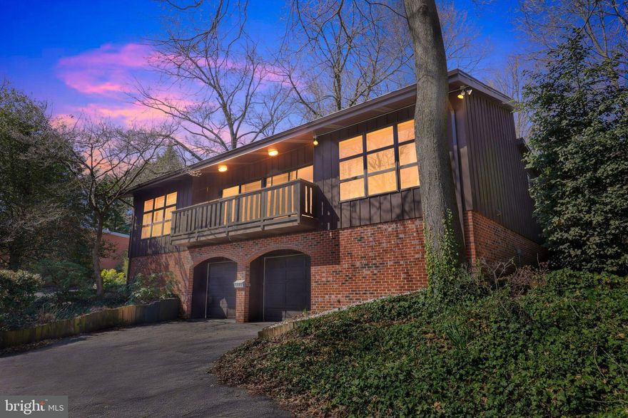 If you’ve been searching for a home that truly stands apart, you’ve found it at 2303 Riddle Ave. Thoughtfully crafted, this one-of-a-kind property blends character, function, and modern design. Enter conveniently through the garage or follow the charming brick path along the right side of the home to the private main entrance at the rear. The sliding door welcomes you into the beautifully updated kitchen, featuring a stunning waterfall island, that’s as functional as it is eye-catching. With seating for 4 and generous prep space, it’s ideal for the chef in your home. Both the slider and kitchen window overlook the large deck and private backyard — a peaceful setting that feels far removed from city living. Entertaining comes naturally here. The spacious, open living room with vaulted ceilings, exposed beams, and a separate dining area sits just steps from the kitchen, creating an inviting flow where no one feels left out of the conversation. You may choose to step out onto the front balcony deck to relax and take in the neighborhood views. Hosting gatherings indoors and out is a breeze. Back inside, the well-appointed primary suite is a true sanctuary, complete with an ensuite bath, walk-in closet, and electric blackout blinds for ultimate comfort. On the opposite side of the main level, Bedroom 2 offers its own full bath and ample closet space. Main-floor laundry is conveniently tucked near the spiral staircase leading to the lower level. Downstairs, Bedroom 3 features a large walk-in closet and access to a convenient half bath. This flexible space is perfect for guests seeking privacy or equally suited for a home office.  Step out to the massive garage, that easily accommodates two vehicles and includes an impressive 25' x 14' storage area — a rare and valuable bonus. Beyond the home itself, the location is exceptional. Less than one mile to museums, Conaty Park, and the sought-after dining and shopping of Trolley Square. Just one mile to both Brandywine and Rockford Parks, 1.5 miles to the Christiana Health complex, 2.6 miles to the train station, and 3 miles to DuPont Country Club. This is city living — with space, style, and privacy.