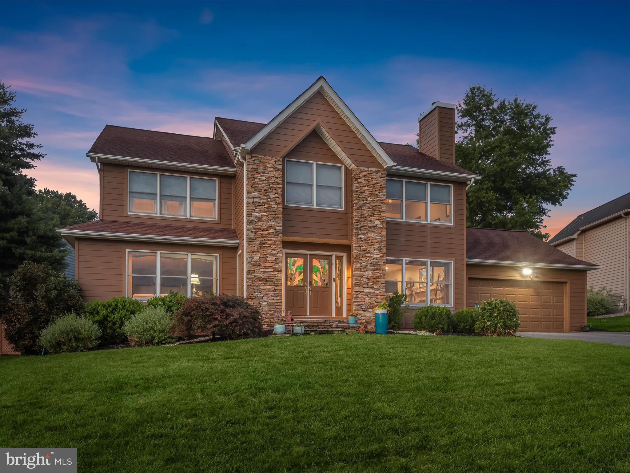 Introducing this exceptional home in the sought-after Velvet Hills South neighborhood, offering four bedrooms, two full bathrooms, and two half bathrooms across three finished levels. An entertainer’s dream, this home features a natural-gas heated PebbleTec pool, oversized gazebo with built-in flat-top grill, and a custom waterfall and pond. Beautifully manicured landscaping sets the tone as you arrive. Inside, the foyer opens to gleaming hardwood floors that continue throughout the main and upper levels. Host gatherings in the open concept living and dining rooms, accented with elegant crown molding and chair railing. The gourmet kitchen is equipped with granite countertops, a tile backsplash, built-in range hood, and premium Bosch appliances including a five-burner gas cooktop, two ovens, and a built-in microwave. A large center island with additional storage and a bar sink adds convenience, while the vaulted breakfast room with access to the pool seamlessly blends indoor and outdoor living. Relax in the cozy family room with its wood burning fireplace. A half bathroom and a laundry room with storage and garage access complete the main level. Upstairs, the primary suite offers a walk-in closet and a recently renovated luxurious ensuite bathroom with a freestanding jetted tub, dual-sink vanity, and walk-in shower. Three additional bedrooms and a hallway bathroom complete this level. Downstairs, the finished lower level expands the living space with a media room perfect for watching movies or the big game. The recreation room is ideal for a play room, office, or gym with a built-in sauna. This level also includes a half bathroom, cedar closet, and ample storage. Step outside to your own retreat designed for both relaxation and entertaining. Lounge by the heated pool, enjoy quiet mornings taking in the views, or gather under the gazebo for outdoor dining. Thoughtful landscaping and outdoor lighting enhance the setting and ambiance. Recent updates include new HardiPlank siding, a tankless gas water heater, and the primary bathroom renovation.