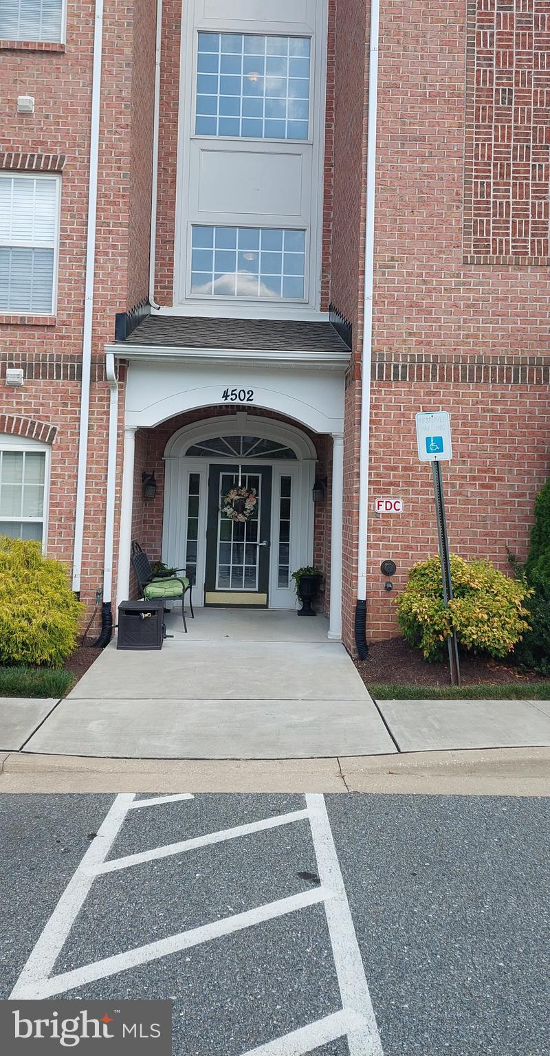 Don't miss the opportunity to own this beautiful penthouse condo in the sought after community of Windsor at Perry Hall Farms. Convenient to everything, the ample parking and secure entry building make this community a gem. As you enter the condo through the beautiful hardwood foyer, the spacious open concept living room with separate dining area, fireplace, crown molding, chair rail, and vaulted ceilings are sure to impress. Perfect for entertaining, this area also opens to a separate breakfast room with slider to private balcony bringing in plenty of natural light. The well equipped kitchen boasts Corian countertops, ample cabinetry, a pantry, a peninsula with seating, and all appliances convey. The laundry area is conveniently located across the hall from the kitchen, and includes the washer and dryer. The popular split floorplan ensures plenty of privacy, with the second bedroom and full bath on one side, and the spacious primary suite on the other. The primary suite provides a quiet retreat with a large walk-in closet and an ensuite bath. The second bedroom has a large closet and is right next to the second full bath. There is a large in unit storage closet off the foyer, with an additional private storage room in the building just across the hallway. The unit is freshly painted with new carpeting, newer hot water heater and microwave. The condo comes with one assigned parking space, and tons of unassigned parking. Minutes from multiple shopping and dining options, public parks, library, and Route 1 and 95 this exceptional penthouse is truly convenient to everything!