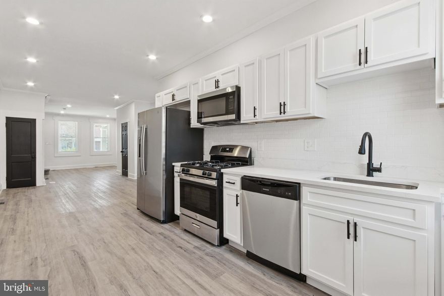 Stunning Fully Remodeled Home in Mosher Neighborhood!

Welcome to this beautifully renovated 3-bedroom, 2.5-bathroom home in Baltimore City's Mosher neighborhood! Step inside to find modern elegance, featuring  LPV flooring throughout, recessed lighting, and an open-concept design perfect for entertaining. The kitchen boasts stainless steel appliances, sleek countertops, and stylish cabinetry.  

Enjoy a spacious primary suite well-appointed bathrooms, and ample natural light in every room. Relax on the charming front porch or take advantage of the home's convenient location—just  minutes from the MARC Station and public transportation for an easy commute.  

Don’t miss out on this move-in-ready gem—schedule your showing today!