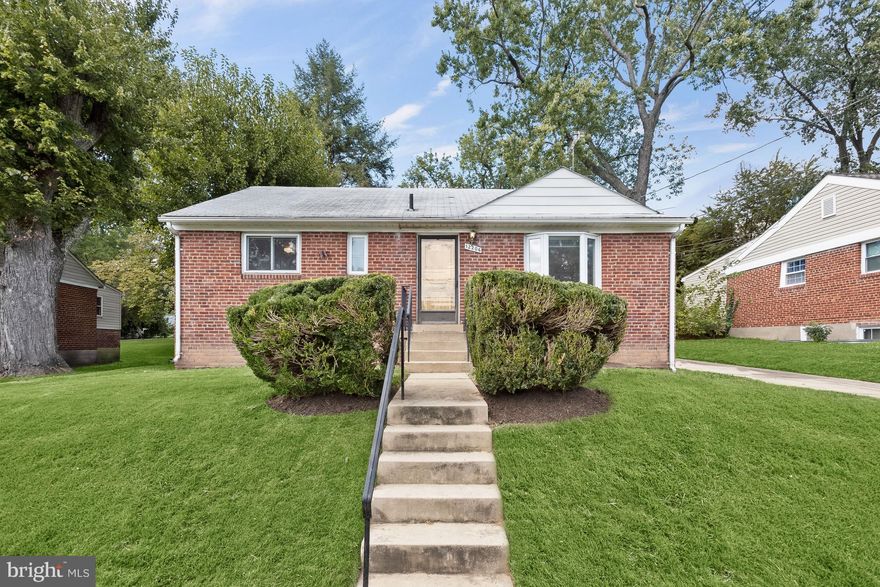 An inviting and charming ranch-style residence nestled in the heart of Silver Spring, MD.   As you pull into the driveway, you'll notice the beautiful brick exterior and convenient carport with space for one vehicle. Step inside to discover the warmth of gleaming hardwood floors throughout the main level, complemented by a neutral color palette that will easily accommodate any design style.  The open floor plan of this lovely home features a combination dining and living room, complete with built-in bookcases, perfect for showcasing your favorite novels, family photos, or decorative items. You'll love the easy flow between the living areas, making entertaining a breeze.  The heart of the home, the eat-in kitchen, offers ample cabinet and counter space, as well as a large pantry for all your storage needs. A fully finished lower level provides additional living space, with cozy knotty pine accents and endless possibilities for a recreation room, home office, or guest suite.  Outside, you'll find a beautiful backyard perfect for outdoor entertaining or simply enjoying a quiet evening with your loved ones.  Don't miss this incredible opportunity to own a beautiful piece of Silver Spring. Schedule a private showing today and experience all that this wonderful home has to offer!  Major commuter routes include US-29, I-95, and I-495 for easy access to Washington D.C., Baltimore, Wheaton Regional Park, Woodmont Country Club, and a plethora of shopping and dining options.