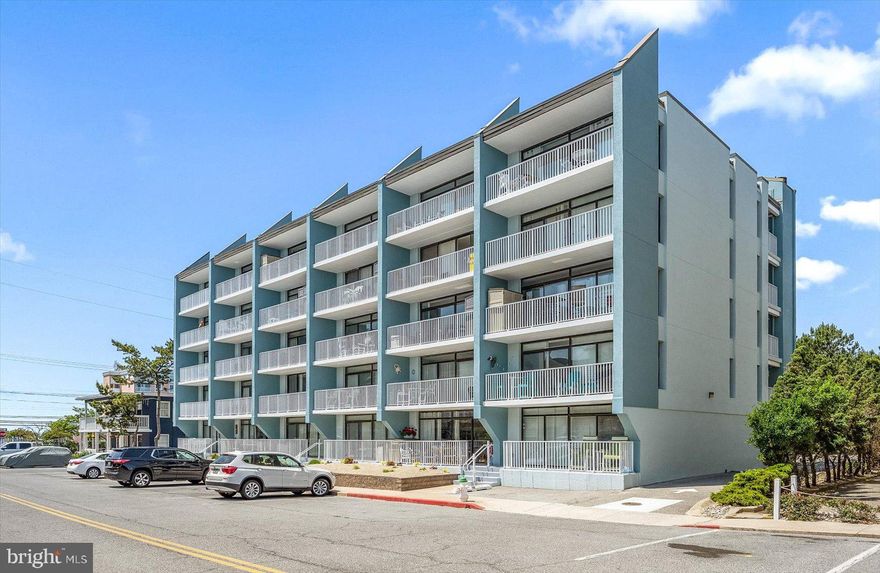 This is your new place at the beach!  Just imagine living in a quiet, newly renovated, concrete building with views of the ocean and bay and low condo fees.  This property has been shored up, stairs and railings replaced, freshly painted, newly replaced elevator, and completely paid for with special assessment, which has been paid for by the seller.  Perfectly located within walking distance of beach, bay, bus stops, Seacrets, Coconuts, and many restaurants.  Located across from the Convention Center makes this property a great investment, with rental income all year round.  Both bedrooms have new mattresses with boxsprings and a new pull out sleeper couch in the living room.  Schedule your showing today!