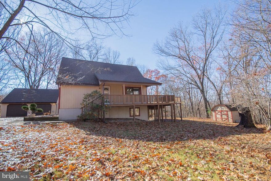 Welcome to your dream retreat in the woods! This enchanting 2-bedroom, 2-bathroom chalet is a hidden gem nestled atop North Mountain, offering you a picturesque haven surrounded by nature's beauty. As you wind your way up to the property, anticipation builds, and the stress of the day melts away, replaced by the tranquility that only a wooded escape can provide.  Prepare to be captivated by the breathtaking evening sunsets that paint the sky in hues of orange and pink, providing the perfect backdrop for your secluded mountain sanctuary. Take in the awe-inspiring views of Back Creek Valley and Third Hill Mountain from the expansive multi-level wrap-around deck. Whether you're sipping your morning coffee or enjoying a glass of tea at sunset, this deck is your front-row seat to nature's own masterpiece.  Step inside, and you'll be greeted by a great room that defines the meaning of spacious and airy. The cathedral ceiling adds a touch of grandeur, creating an open, inviting atmosphere that's perfect for both relaxation and entertaining. Large sliding doors seamlessly connect the great room to the back yard, allowing a seamless flow between indoor and outdoor living.  The partially finished basement expands your living space, providing a den and recreation room that offer endless possibilities. Imagine cozy movie nights, a home gym, or a game room—the choice is yours! The unfinished laundry area adds practicality to this versatile space, ensuring your home meets all your needs.  Need space for your vehicles and an RV? No problem! This property boasts a detached 2-car garage with an RV hook-up, providing the flexibility you desire. The convenience of a circular paved driveway ensures easy access, making every arrival and departure a breeze.  Situated on a sprawling wooded 1-acre lot, this chalet is a nature lover's paradise. Embrace your green thumb with two raised garden beds, perfect for cultivating your favorite flowers, herbs, or vegetables. A charming storage shed adds a touch of practicality, giving you ample space for all your outdoor essentials.  Escape the hustle and bustle of everyday life and make this chalet your sanctuary in the woods. Whether you're seeking a weekend retreat or a year-round haven, this property offers the perfect blend of serenity and convenience. Don't miss the opportunity to call this chalet home—your private escape awaits!