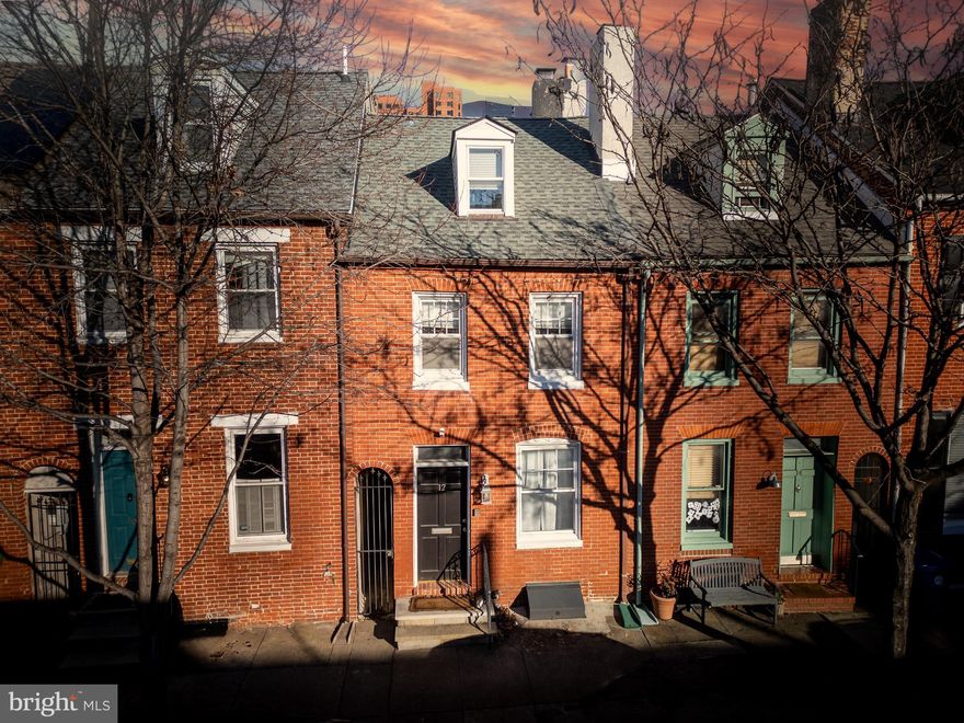 Nestled in the heart of Federal Hill, this charming 3-bedroom 2-bath home with a finished basement could be YOURS! With a nice mix of modern & original character, this home boasts exposed brick and original hardwood floors. The main floor welcomes you with a cozy living room complete with a gas fireplace,  dining area, & kitchen with stainless steel appliances.  Outside enjoy the picturesque private deck/garden & gated breezeway. On the upper level, you'll find two generously sized bedrooms, a full bathroom, & conveniently located laundry facilities. Once on the top level, where the primary bedroom is with an en-suite bathroom and access to the rooftop deck, where relaxation awaits. The lower level presents endless possibilities, offering ample space for a versatile living area, a fourth bedroom, an office, or even a personal gym with ample storage. Situated in a vibrant community, you'll enjoy effortless access to an array of shopping, dining, & recreation. Don't miss out on this incredible opportunity to own a true Federal Hill gem. Schedule your private tour today!
