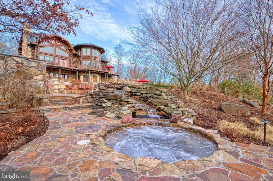 Nestled in the picturesque mountains of West Virginia, this extraordinary lodge boasts over 8,000 square feet of luxury living. The grandeur begins at the entrance where an automatic gate framed by two majestic stone pillars gives you a glimpse of what is to come.  The extra wide paved driveway, adorned with commercial streetlights, extends three-quarters of a mile leading to the log residence, the heart of the property.   Spanning over 186 acres, you'll find a harmonious blend of natural beauty and meticulously crafted features.

As you enter the four-bedroom main residence, you are greeted by breathtaking views of the Allegheny Mountains enjoyed from the countless floor to ceiling windows and the craftsmanship of hand-peeled Lodge Pole Pine logs harvested in Montana. The Gambrel copper roof, copper gutters, and downspouts add a touch of elegance outside, while the massive 36-foot mountain stone fireplace and chimney in the Great Room are just one of countless features creating a warm and inviting atmosphere inside.

Designed for comfort and convenience, the home features an 8-zone heating and cooling system with steam electronic air cleaners. Flagstone patios, decks and French doors located throughout the property showcase the stunning surroundings and allow natural light to flood the interiors.

Outdoor amenities abound, including a vanishing edge pool with a waterfall and spa, a regulation-size tennis court equipped for pickleball and basketball, a greenhouse, and approximately 2.5 miles of manicured trails that wind through the property. Four small creeks flow across the estate into Crooked Run Creek, a major historical creek dating back to before the Civil War.

For equestrian enthusiasts, a stable complex includes a lighted riding arena, well-appointed stalls, a hot walker, and pastures. The barn complex also features a one-bedroom apartment, providing both functionality and comfort. Both the main residence and the barn complex have their own well, septic system, and emergency generator, ensuring self-sufficiency and peace of mind.

Recent improvements include a newly installed gate entry system and a Fiber Optic telecommunications Network providing internet connectivity with speeds up to 1 Gigabits per second.  The current utilization operates at 500 megabits per second and supports the implementation of the Eeros WiFi Nest System, the Ring camera Security System (9 total installed) and the Honeywell T5 WiFi-enabled thermostats (9 total) throughout the entire house as well as the barn. 

This property is a sanctuary of luxury, offering a rare combination of pristine natural surroundings, state-of-the-art amenities, and exquisite craftsmanship. It is a testament to fine living in the heart of West Virginia's beauty.