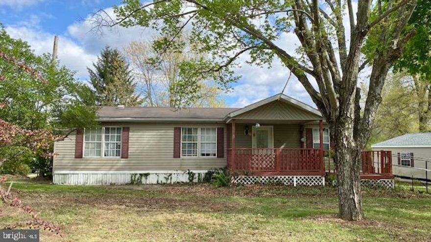 This charming ranch-style manufactured home, nestled in a desirable neighborhood, offers a perfect blend of comfort and functionality. With 1,200 square feet of thoughtfully designed living space, this residence features three bedrooms and two bathrooms, master bedroom has a walk-in closet, it's own bathroom with a newer vanity and a convenient walk-in shower. The family room is open to the kitchen and creates an ideal space for gatherings and everyday living, enhanced by ceiling fans that add a touch of comfort along with central A/C. Situated on a 0.47-acre level lot, the outdoor space is great for relaxation or entertaining, enjoy the front or back porch. The detached two-car garage provides ample storage and parking, while the paved driveway ensures easy access. Residents enjoy the close proximity to major amenities, local parks, or its short distance to Raystown Lake, perfect for leisurely strolls or weekend picnics. Showings will begin Saturday April 25th. Additional photos to be added and an Open house is scheduled for Sunday April 26th from 1-3pm.