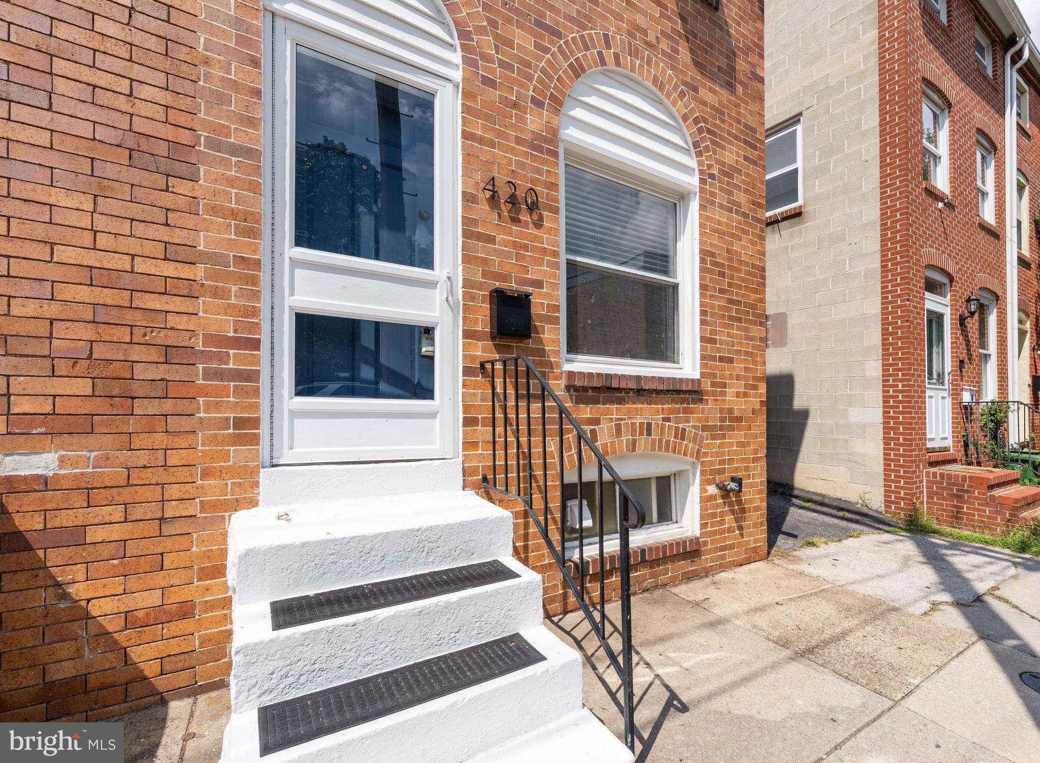Welcome to 420 E Cross Street – a beautifully updated end-unit rowhome located just blocks from Cross Street Market and the heart of Federal Hill. This 2-bedroom, 1-bath home perfectly blends historic charm with thoughtful modern updates, making it an ideal starter home or investment opportunity in one of Baltimore’s most desirable neighborhoods.
Step inside to discover exposed brick, original beams, and gleaming hardwood floors that add warmth and character throughout. The bright, open layout is enhanced by recessed lighting and fresh paint. The updated kitchen features sleek cabinetry, stainless steel appliances including a gas range, and opens directly to a large fenced patio—perfect for relaxing, entertaining, or gardening.
Upstairs, you’ll find two bedrooms and a fully renovated bath with a luxurious stone and tile shower. The spacious primary suite includes a walk-in closet and generous natural light. A large lower-level basement provides laundry and abundant storage space.
Enjoy unbeatable walkability with Outpost Tavern just steps away, Federal Hill Park two blocks over, and Cross Street Market only three blocks from your door. Head toward the water and in under five minutes, you’ll reach Di Pasquale’s and Bellini’s Harborview, two local favorites situated right on the waterfront, offering stunning views, delicious food, and a vibrant neighborhood vibe.
Don’t miss this opportunity to own a stylish, move-in-ready home brimming with charm, walkability, and convenience in the heart of the city.