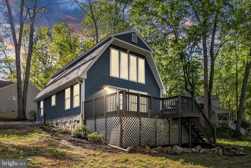 Welcome to your dream cottage in the fabulous gated community of Lake of the Woods! This stunning A-frame retreat has been meticulously renovated and is ready for you to start living the lake lifestyle today. Whether you’re seeking a second home or a lucrative Airbnb investment, this property offers everything you need and more.

As you step inside, you’ll be greeted by an inviting interior that boasts high-end finishes and thoughtful updates. The luxury vinyl plank flooring adds both durability and style, perfectly suited for a lakeside getaway. Charming details like beam ceilings and shiplap walls enhance the cozy cottage feel. The gourmet kitchen, featuring the cutest tile work and upgraded appliances, is a chef's delight, making cooking a joy. Both bathrooms are elegantly tiled, providing a spa-like retreat for relaxation. For those chilly evenings, you can cozy up by the stone gas fireplace, or enjoy the ambiance of the electric fireplace in the upper level, all while taking in breathtaking lake views.

This amazing property is located within an amenity-rich subdivision that offers a clubhouse with lakeside dining, a fitness center, a pool with stunning lake views and  an 18-hole golf course. You’ll also find a community center and extensive walking and biking trails, perfect for enjoying the great outdoors. Don’t let another day go by without experiencing the tranquility and joy of lake living. This property is not just a home; it’s a lifestyle waiting for you to embrace. Come visit today and envision your future at Lake of the Woods!