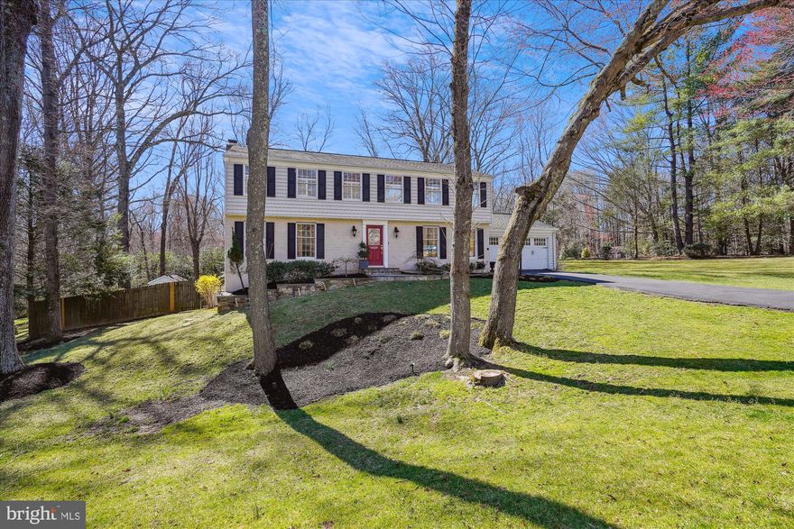 Classic colonial on ideal .61 Acre corner lot in sought-after Folkstone neighborhood.  Great curb appeal and spectacular outdoor space include an in-ground pool for summer fun, deck, patios and fenced backyard. This 4 Bedroom 3.5 Bath home has everything you are looking for in your next home including hardwood floors and 2 warm and inviting Fireplaces (one is Gas and one is Wood-burning).  You are welcomed by a handsome fieldstone walkway to the front porch. As you enter the leaded glass front door into the foyer, you are greeted with rich hardwood flooring and an abundance of natural daylight streaming through the front windows. The foyer is flanked by the Living Room with  built-ins and the formal Dining Room where you are sure to host countless dinner parties. The renovated Kitchen offers plenty of creamy wood cabinetry and quartz countertops as well as a stylish tile backsplash. It is well-appointed with stainless steel appliances, including an induction surface stove and even a pot filler. The central island offers a stainless steel farmhouse sink and a KitchenAid Dishwasher. You'll enjoy an abundance of counterspace and windows overlooking the backyard. The Kitchen is wide open to both the Breakfast Room and Family Room. The Breakfast Room features a built-in display to store glassware or your bespoke collection of pottery. The Family Room enjoys a warm and inviting wood-burning fireplace with glass doors as well as access to the deck through full-view atrium doors. Wander out to the deck to relax  with a glass of wine  under the awning of the Pergola to watch the sunset. A Mudroom and Powder Room round out the main level. Ascend the Hardwood Staircase to the upper level where you find 4 spacious Bedrooms, an Office/Study (could easily be a 5th Bedroom) and the Laundry. The Primary Suite offers a large Bedroom with a renovated bath. The Primary Bath offers a large walk-in shower, new dual sink vanity and a private water closet. The Primary suite opens to a 2nd Bedroom that would be an ideal nursery or dressing room.  Alternatively, close it off to make a conventional bedroom. The 3rd and 4th Bedrooms are freshly painted and have new carpeting. The large Study is perfect for homework or for use as a home office. It enjoys a window overlooking the backyard and has a large walk-in closet It could easily be converted to a 5th Bedroom. The Laundry is conveniently located on the bedroom level and it boasts a wall of storage. The seemingly endless walk-out Lower Level has a spacious Recreation Room, a Den/Guest room, a Full Bath and an ample Workshop/Storage area. The Rec room enjoys a Stone Gas Fireplace, with an ideal area for movie night as well as a billiards area. A large Wet Bar features a wall of cabinetry, wine refrigerator, sink and floating wood shelves.  Ideal  for game day entertaining!  Walk out to the lower level patio and yard. Your perfect outdoor oasis also includes a breathtaking in-ground pool, spacious pool deck, upper deck with pergola and awning. Relax by the pool or have friends over for a summer BBQ. Lush landscaping and garden path leads you to another intimate patio that overlooks the garden and the pool. The yard is fully fenced. A garden shed provides plenty of space for garden tools and pool accessories. A large side yard is ideal for kicking around the soccer ball. All of this and the convenience of easy access to commuter routes, shopping, and restaurants.  Minutes to Reston Town Center, Fairfax Corner, and Fair Oaks.  A short drive to Dulles International Airport. Schools are Crossfield Elementary, Carson Middle and Oakton High School.  OFFER DEADLINE MONDAY 3/31, 8 PM.