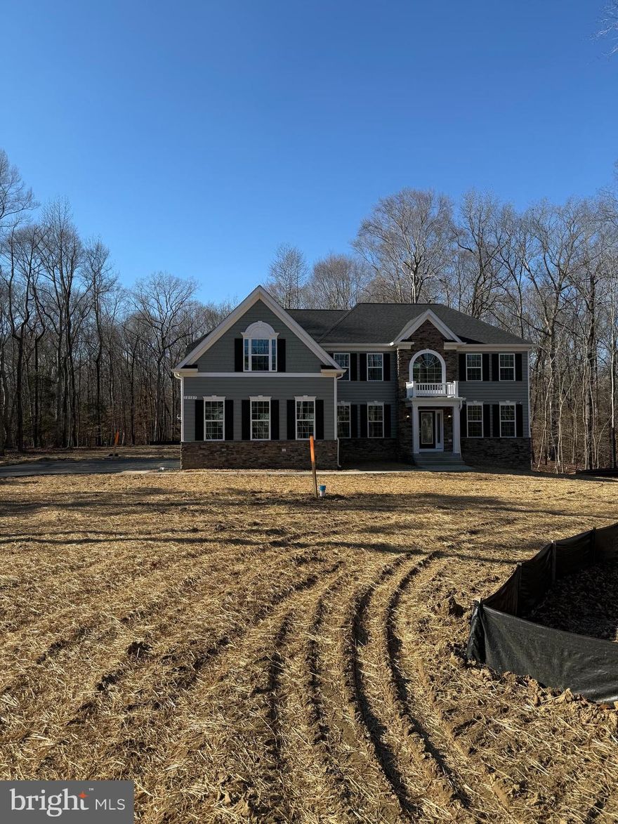 QBHI's popular Willow on this premium lot in Fischer's Grant. The future customers chose beautiful upgrades and finishes. The main level has LVP flooring, full bath by the study, formal living and dining rooms, stone fireplace, upgraded kitchen with large Island, stainless steel appliances and beverage station. Upstairs has huge owners suite with sitting area, full bath with QBHI's signature deluxe shower and separate tub. Laundry upstairs as well. Basement has a large recreation room and full bath and plenty of storage.