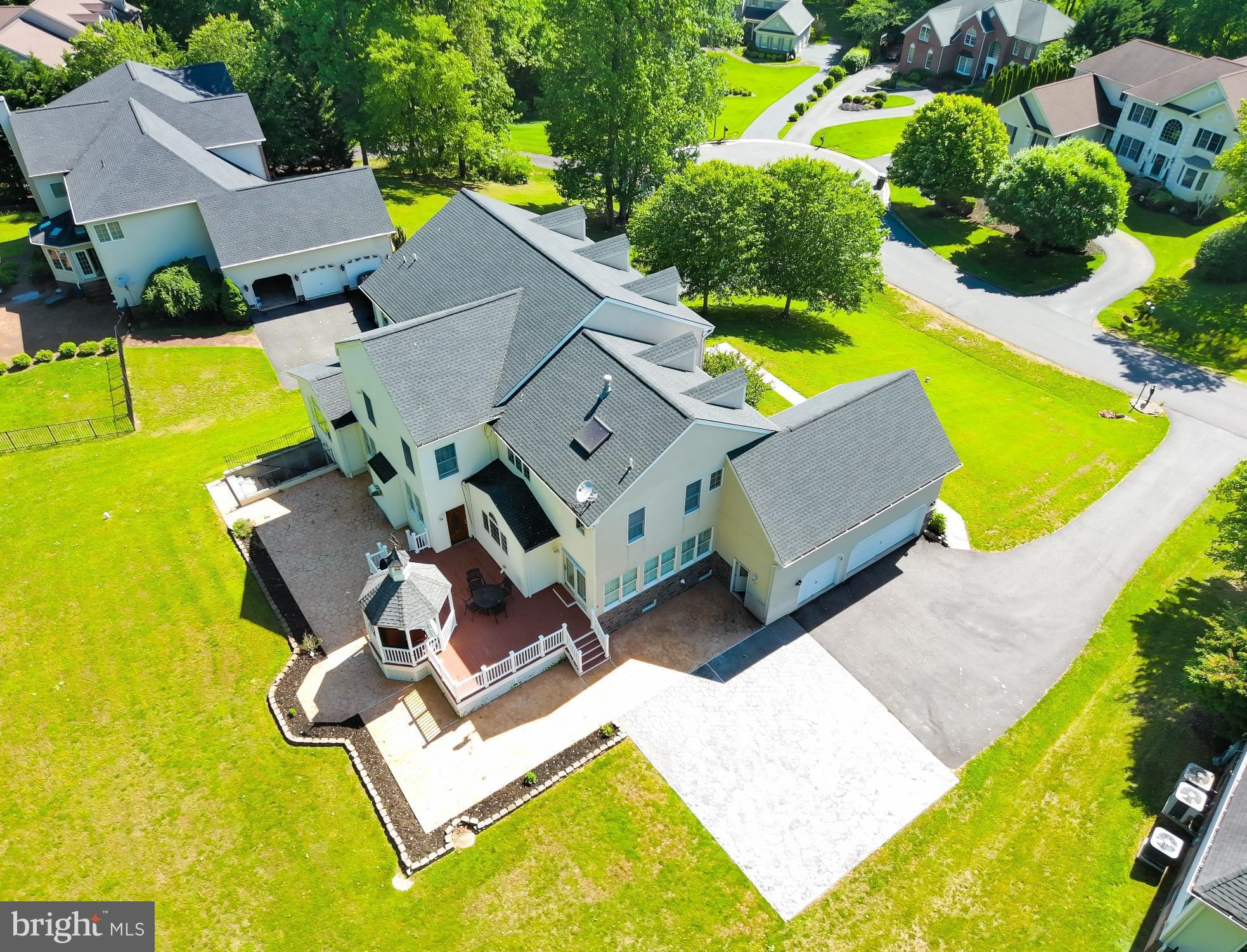 Step into this spacious 5-bedroom, 5.5-bath residence nestled in the highly coveted Morning Brook Farms community. From its expansive layout to the thoughtful design details, this home offers the perfect balance of everyday functionality and effortless entertaining.
The main level welcomes you with rich hardwood flooring, detailed moldings, chair rails, and architectural columns that add character and sophistication throughout. The inviting floor plan flows seamlessly from the sunken family room with a cozy gas fireplace, into the spacious gourmet kitchen and elegant formal dining room—creating an ideal space for gathering with family and friends. The kitchen was thoughtfully designed for both culinary creativity and connection, featuring ample space to cook and entertain.
Additional highlights on the main floor include a formal living room, a private home office, sunroom, and laundry area located just off the oversized 3-car garage.
Upstairs, the luxurious primary suite serves as a peaceful retreat with its own fireplace, sitting area, walk-in closets, and spa-like bathroom featuring a jetted tub and separate shower.
The fully finished lower level extends the living space and offers incredible flexibility, complete with an additional bedroom, full bath, second full kitchen, fitness room, movie room, and walk-out access to the backyard—ideal for guests.
Step outside to your backyard oasis, perfect for entertaining, gardening, or simply enjoying a quiet moment surrounded by nature.
With space, comfort, and charm at every turn, this home is ready to be the backdrop for your next chapter.