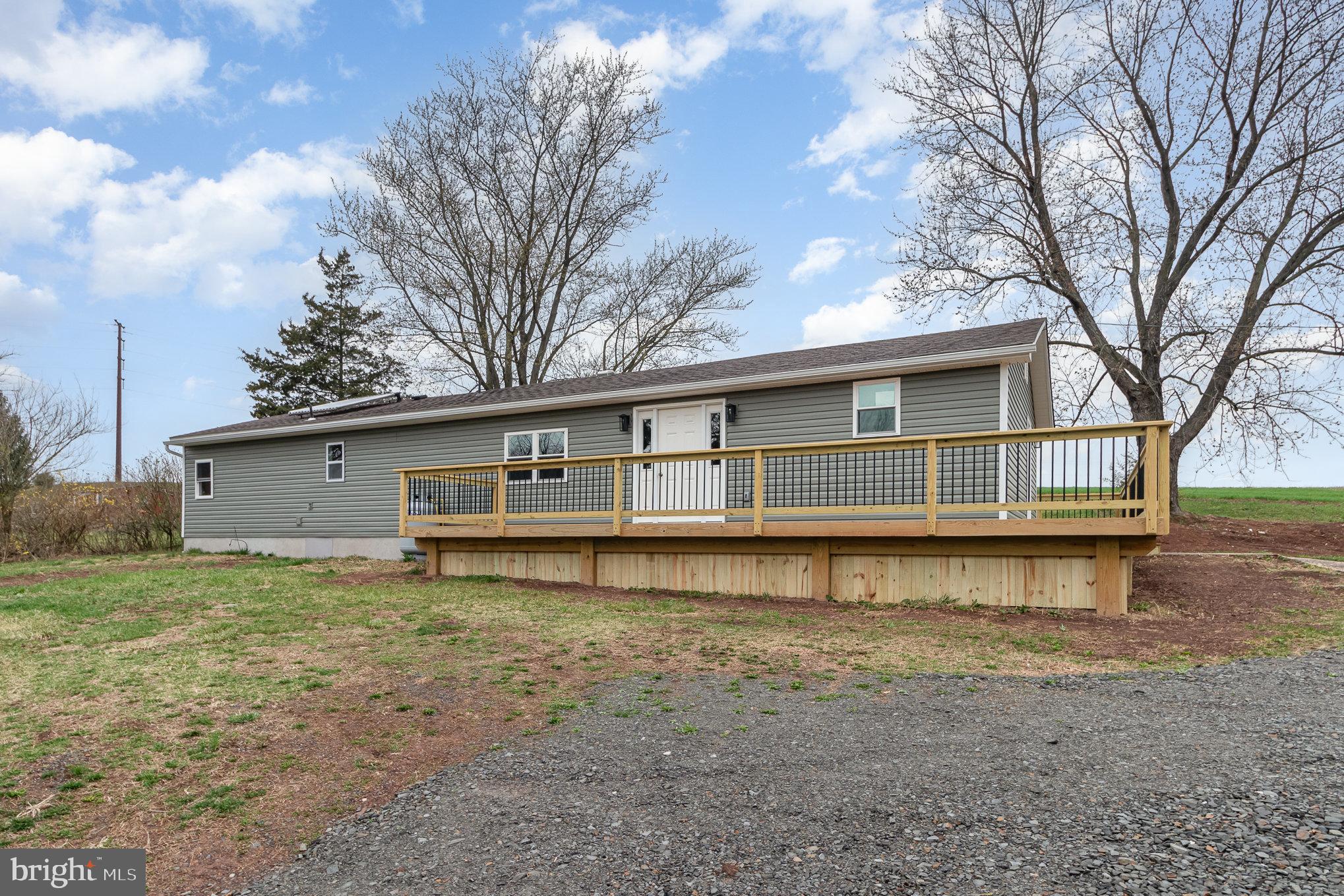 Welcome to this beautifully remodeled home, nestled in a serene country setting in Upper Paxton Township and located within the Millersburg Area School District. Step inside to discover 1,680 square feet of thoughtfully finished living space, featuring all-new windows, plumbing, electric, attic insulation, siding, drywall, flooring, recessed lighting and more. Updated kitchen complete with brand-new stainless steel appliances, and gas range. The layout has been enhanced with the addition of a full primary bath, creating a true primary suite retreat. As you enter, you’re greeted by a versatile mudroom/office space. Convenient laundry area just off the bedrooms. The cozy living area is warmed by a propane fireplace, making it the perfect spot to unwind. Outside, you'll find a detached shed equipped with electric—perfect for use as a workshop, hobby space, or she shed. An upper attic area provides additional storage options, making it as functional as it is versatile. There’s even the potential for solar hot water (equipment is in place but currently not connected). "Enjoy the benefits of a larger lot, offering flexible outdoor space for entertaining, gardening, or relaxing. Don’t miss this move-in-ready gem with modern upgrades, generous outdoor space, and convenient access to local amenities!