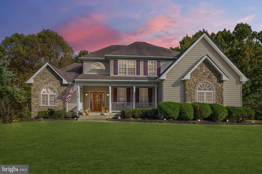 HONEY LOOK AT THIS, THIS IS THE ONE!!! And I couldn?t agree with you more! Your new home welcomes you and your family with beautiful landscaping escorting you to the large front porch and gorgeous front door! Upon entering you?ll find yourself smiling and admiring its beauty with crown molding and brazilian cherrywood flooring walking you into the kitchen of your dreams! Flaunting quartz countertops, an oversized island, soft close custom cabinetry, upgraded stainless steel appliances, a built in coffee pot, and a dry bar with a built in wine chiller your gourmet kitchen will more than satisfy any cook! Relax in the breakfast area overlooking your picture perfect backyard! Having an open floor plan between your spacious living room and stunning kitchen hosting family and friends will be a breeze! Doing laundry will be fun in your large walk in main level laundry room with built in ironing board and plenty of shelving! Luxurious describes your main level master suite holding two wonderful closets with custom storage! Offering granite counter tops, dual vanities and a gorgeous tile shower with double shower heads?your stylish master bathroom awaits you! Upstairs you?ll find four large bedrooms, three of these bedrooms have walk in closets! The upstairs bathroom presents you with granite counter tops, dual vanity and tile shower! The lower level is prepared to accommodate any of your needs providing two large bedrooms, an office, a full kitchen and bathroom, its own washer and dryer, a generous size living room or entertainment area, recessed lighting, ample amounts of storage space, its own access to the garage and a quality home stereo system to enjoy inside or outside on two stone patios and a fire pit while making memories! Your new home has been very well taken care of, has a ton of upgrades, newer air conditioning systems, gutter guards, a 90 gal. water heater, a water filtration system and a home security system! Conveniently located off of route 3, minutes to I95, tons of shopping and a commuter lot! All of this with NO HOA!!  Nothing left to do but move right in and love showing it off!