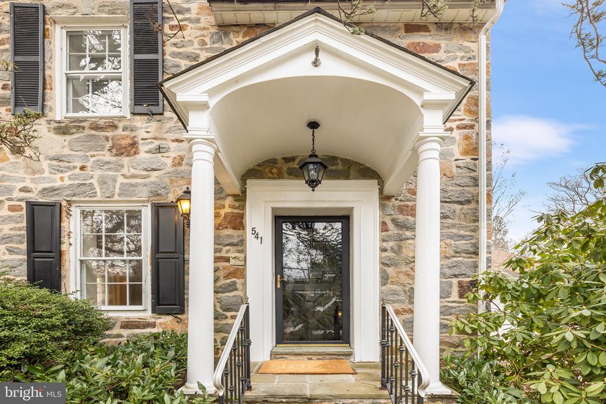 This classic 4 BD, 3 BA stone colonial is nestled in the heart of Strafford Village - one of the most popular neighborhoods in Wayne! With its timeless stone façade and traditional architectural details, this home exudes character and curb appeal. The generous floor plan offers gracious room sizes and ample space for both daily living and entertaining. First floor features include a large Living Room with wood-burning fireplace, sunny Dining Room with bay window, Kitchen with gas cooking and adj. Breakfast Room, large Mudroom, Laundry Room, and a main floor 3rd full BA.  You’ll love relaxing in the vaulted Family Room, which has a gas fireplace, loft, and built-in bookcases. Large windows invite abundant natural light, and there are hardwood floors in most rooms. Both the Kitchen and Laundry Room feature extensive storage in sturdy oak cabinets. Relax on the composite rear deck, overlooking the open  and level nearly 1/2 acre lot, which provides ample room for recreation and outdoor activities. 2nd floor features large Primary BD with 2 closets and en suite BA, 3 more Hall BD, and large Hall BA with double vanity and tub/shower combo. The walk-up 3rd floor Attic has several closets and offers great potential for adding a 5th BD suite or Office(s). Add’l storage is found in the partially-finished Lower Level which also has a large Rec Room with built-in bar. The corner lot location features two entrances. Visitors can park in the circular front driveway which leads to the main Entrance Hall, or on the garage side of the house, where there is another covered porch entrance. Located just moments away from shops and restaurants, top-ranked Tredyffrin-Easttown schools, and within walking distance of the train, this home offers a perfect opportunity for those looking to customize and update to their unique style and preferences. Don't miss this spacious home in a wonderful Main Line neighborhood!