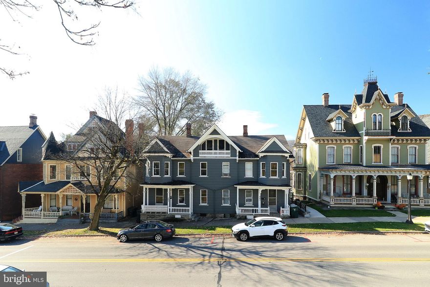 This exceptional Bellefonte investment property offers a unique opportunity for investors or those seeking a residence with potential income. This large triplex boasts a generous 3,500 square feet of living space, including beautiful hardwood floors. With a total of 6 bedrooms, 3.5 bathrooms, and numerous distinctive features, this property presents a desirable prospect in a prime location. The large left side unit (243) features a spacious layout, including a bonus area on the upper level, ideal for an office or extra sitting area. There are 3 comfortably sized bedrooms, 1.5 baths, bright and inviting living room and dining room, an updated kitchen equipped with stainless steel appliances, a large, private rear deck and enclosed sunporch on the second floor offering wonderful mountain views. The right side, first floor unit (245), boasts a generously sized living area with a decorative fireplace, adding a touch of character to this cozy space. A fully equipped kitchen, one large bedroom with a full bathroom and access to a private rear deck complete this unit. The right side, second floor unit (247), delivers a charming living room for relaxation, a second well-equipped, spacious kitchen, two bedrooms and one full bath, plenty of closet space and an enclosed sunporch to enjoy the outdoors from within. All three units have their own washer and dryer. Outside you will find a generously sized backyard providing outdoor space for recreation and a substantial 38' x 20' detached garage. The right-side units (245-247) are currently rented month-to-month, offering immediate income opportunities. The left-side unit is move-in ready, allowing you to either rent it out or owner-occupy and offset your mortgage, making this property an attractive investment opportunity.  Situated in the heart of Victorian Bellefonte, this property is conveniently close to shopping and wonderful dining options, making it highly desirable for tenants or future homeowners. Don't miss out on this outstanding investment opportunity.