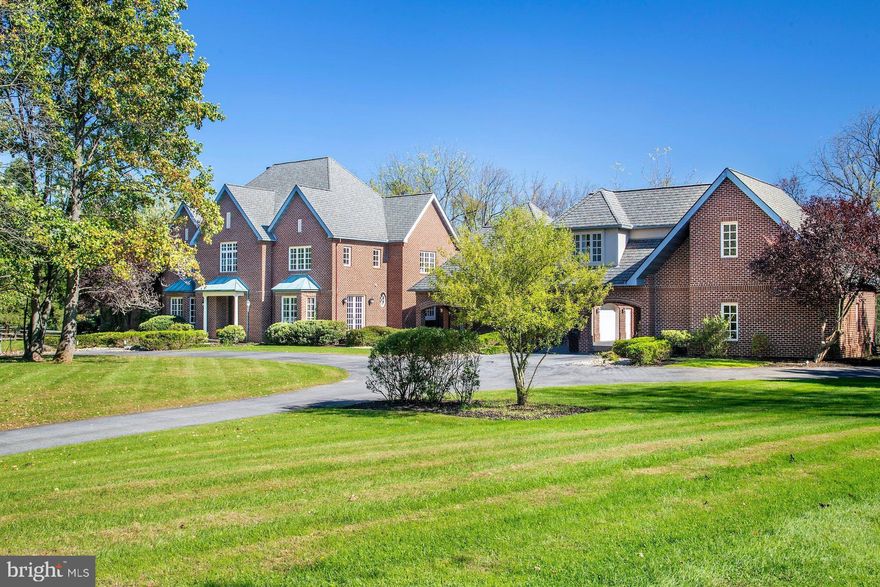 It is a rare pleasure to encounter such a Saucon Valley property, set amidst rich landscaping & glorious gardens, on a park-like 2.4 acres. Wildberry is designed to take full advantage of an ideal location at the end of a Saucon Valley cul-de-sac. Nearby, the residences are unique, both for their timelessness & for their ability to reflect the natural surroundings in their design, with an orientation towards spectacular landscapes, Wildberry is an example of this marriage of land & home. Truly beyond the imagination and enticing one to stay forever, Wildberry is a premiere estate property.  The timeless design offers a floor plan featuring spacious rooms in more than 9,686 sqft on 3 levels.  A wealth of custom details & a sophisticated, yet functional, floor plan attest to a thoughtful design. Romantic details combine with ceramic, marble, wood & granite accents to create a rich & warm atmosphere in spaces of grand proportions that invite one to entertain.  The living room is highlighted by a southwest style fireplace, creating an inviting ambiance & serving as a dramatic introduction to the rooms to come. The gourmet kitchen was designed as the heart of the home and plays its part with ease. The appliances are top-of-the-line, with both Dacor gas & Jenn Aire cooktops, 2 Asko dishwashers, Sub-Zero refrigerator, freezer, freezer drawers & refrigerator drawers, & Dacor double ovens.  2 center islands with granite counters make cooking & entertaining a breeze. Custom cabinets, wet bar, home office & pantry provide the perfect complement for entertaining as well. Steps away, the great room boasts a beamed cathedral ceiling, walls of glass, & a floor-to-ceiling stone fireplace.  Also on the 1st floor is a formal dining room with walls of glass to the front courtyard, an office & an exercise room. Completing the 1st floor, a master bedroom features a wood-burning fireplace, cathedral ceilings, floor to ceiling windows, & doors to a private, walled, back patio. The master bath & walk-in closets will provide fabulous additional spaces to pamper and soothe. On the 2nd floor there are 4 additional bedrooms, while a 3rd floor retreat with full bath offers a variety of uses for extended living space.  Finally, the lower level has abundant room waiting to be finished with amenities such as a home theatre & any additional family needs one might envision. Outside, the home is serenely set & prominently positioned, enveloped by mature trees, manicured lawns, & perennial gardens.  There are lovely outdoor living spaces with patios & private vistas, all overlooking a Koi pond, pool & spa … in a bucolic setting of natural beauty. A 2-car garage is attached, & a porte-cochere adds 2 additional garages with a fully finished guest suite above.  It is a privilege to experience such a home & a special joy to offer this property for sale.