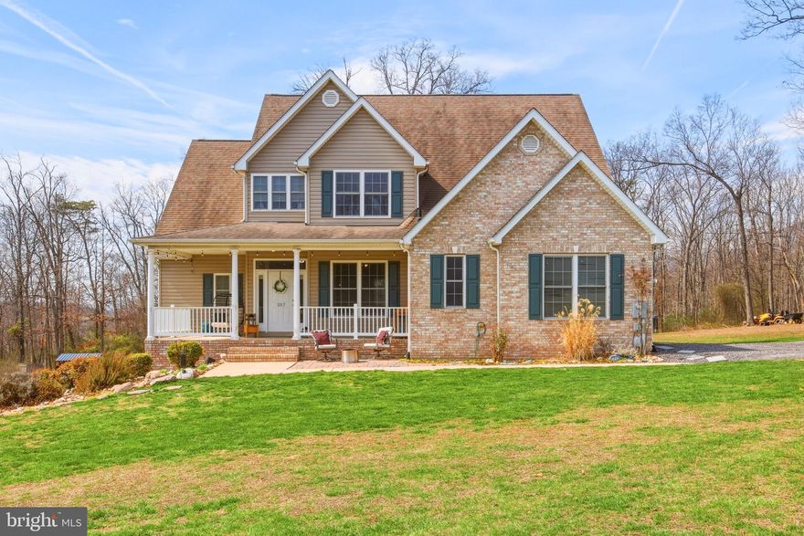 You’re not dreaming—this private country retreat truly has it all! Nestled on 3 peaceful acres in Maurertown VA, this beautiful two-story home offers the perfect blend of space, comfort, and serene natural surroundings.

A welcoming front porch invites you inside to a wide foyer that opens into a spacious living room featuring vaulted ceilings and a stunning stone-front fireplace with a mantel—creating the perfect cozy focal point. This home has also been recently painted, giving it a fresh, updated feel throughout. The dining area is filled with natural light and offers lovely views of the backyard, creating a warm and inviting space for everyday living or entertaining.

The upgraded kitchen provides abundant cabinet and counter space, and the cabinets have been refreshed with a stylish facelift—offering a modern touch while maintaining charm. The main level also includes a beautifully redone laundry room, a convenient half bath, and a flexible space that can serve as a home office or formal dining room.

The primary suite offers a peaceful retreat with a walk-in closet and a spacious en-suite bath complete with a double vanity, soaking tub, and separate shower.

Upstairs, you’ll find an open loft area perfect for a second family room, along with three additional bedrooms and a full bathroom—providing plenty of room for everyone.

Step outside to the large back deck overlooking a spacious yard surrounded by trees, offering privacy and a true connection to nature. The yard is already prepped for an above-ground pool, making it easy to create your own backyard oasis just in time for summer. Additional features include an impressive crawl space with 8-foot ceilings for exceptional storage and a two-car garage with extra room for shelving and organization.

Come breathe in the fresh air, enjoy the privacy, and fall in love with everything this beautiful home has to offer.