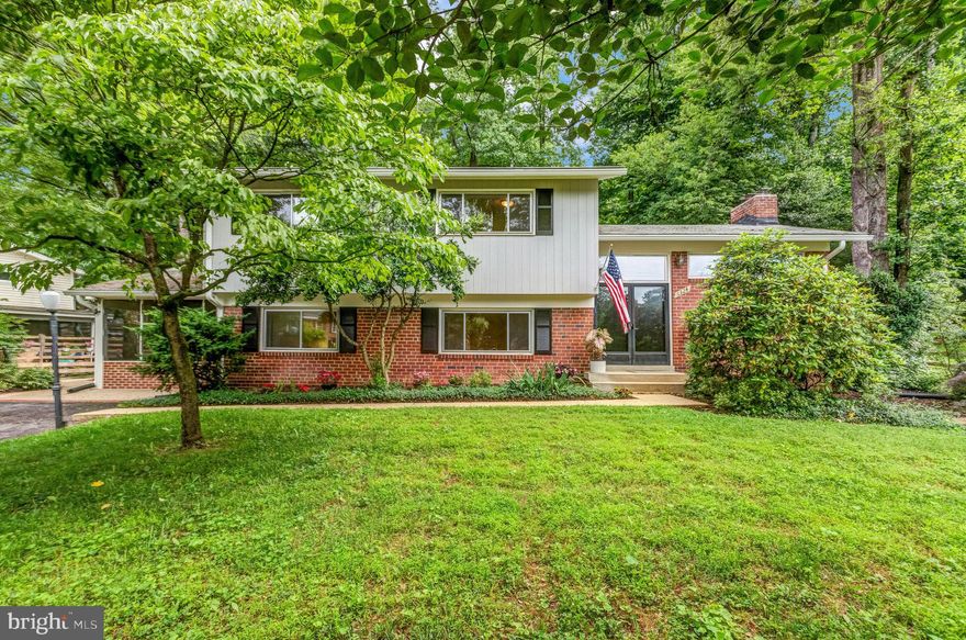 Welcome to Lake Barcroft and 6324 Beachway Drive!  Settle into your new home just in time for another wonderful summer on the lake with five private sandy and lifeguarded beaches (for residents only), boating, fishing, SUPs, and plenty of nature and wildlife to enjoy.  Lake Barcroft residents enjoy a very special oasis inside the beltway and many, many varied community activities, gatherings and clubs – such as, 4th of July Parade and Fireworks, Ice Cream Socials, Movies nights at the beach, Art League, Home tours, barge parties, Women's Club, ice skating - the list goes on and there’s something for everyone! This split level home with mid-century vibes sits on over an  1/2 acre private and tranquil lot and with 5  bedrooms and  2 full bathrooms plus one half bath, there's ample space and comfort for modern living, both inside and out.

As you step inside, you'll be greeted by the elegance of the hardwood floors and light and airy rooms.  The living room features a fireplace and doors opening to the large deck - perfect for entertaining.  Go down a few steps to the formal dining room and windowed kitchen which boasts an induction range, stainless steel appliances, and an inviting eat-in area that is perfect for enjoying your morning coffee.  A glass panel door opens directly to the screened porch, providing another lovely area for meals, coffee or a evening beverage and chat with a friend.   Four bedrooms, including an en suite primary, and a second full bath complete the upper level.  Downstairs you'll find the laundry, a half bath, rec room, and an extra fifth  bedroom, which could also be used as a small office or craft room.  There's a large storage/work room off the rec room.  

Outside, the large yard is filled with mature flowering trees, shrubs and perennials, a fenced backyard, a deck for outdoor gatherings, a patio for relaxation, a screened porch for enjoying the evening breeze, a fire pit area for cool evenings and wooded back for privacy and your own slice of nature.   A storage shed provides a neat space all your outdoor organizational needs.

Situated inside the beltway this home is close to all the commuter routes (50/395/495/66/7) as well as the East Falls Church Metro Station and many shops and restaurants, with easy access to Falls Church, Arlington, Mosiac, Alexandria and DC.  Reagan National Airport is a short drive away.