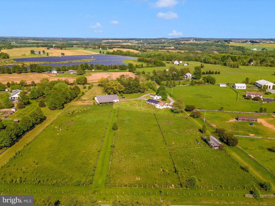 3/4 bedroom rancher with incredible views of the mountain scape.  Oversized attached garage, office, formal living room, dining room and family room.  Chefs appointed kitchen with workspace and ample cabinetry.  Outside: the paddocks, turnout, run in and huge insulated pole barn await.  The barn features matted floors, thermostat controlled fans, water, electric, auto waterers, tack room and store front. The barn is on a separate driveway that jets off the main long winding private drive taking you right past the pond and mature trees.  There is so much to love here!  NOTE the driving directions: If using GPS, please use 12215, when you get to the apron, please come down the 12125 driveway.
