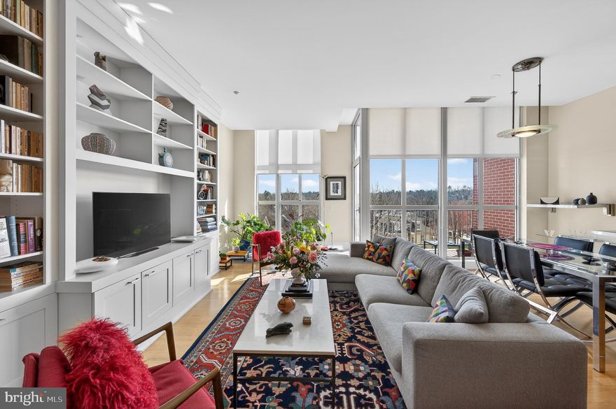 Welcome to Pembroke North, where comfort, convenience, and timeless design come together in this beautifully maintained residence; offered for the very first time since its original purchase in 2010!  Featuring 1,713 square feet of well-appointed living space, this thoughtfully designed 2-Bedroom, 2.5 Bath Condo with a Den strikes that rare balance—much like Goldilocks discovering what feels “just right.”  Not too large, not too small, but perfectly proportioned for both everyday living and effortless entertaining.  The 3rd-floor, south-facing orientation showcases stunning floor-to-ceiling windows and tall ceilings that frame views over Lancaster Avenue while filling the open living spaces with natural light. The open-concept layout seamlessly connects the Kitchen, Dining Area, and Great Room, creating an inviting flow ideal for gatherings or quiet evenings at home.  Just off the main living area, a private Balcony offers the perfect spot to enjoy a morning coffee or take in some fresh air and unwind outdoors.  Each of the two spacious bedrooms features their own en-suite bath, offering comfort and privacy, while the separate den provides the flexibility for a home office, library, or cozy retreat. A convenient Powder Room and in-unit Laundry add to the home’s thoughtful functionality.  This residence includes TWO assigned garage parking spaces and TWO dedicated storage lockers—rare and valuable features that enhance both convenience and livability.  Perfectly positioned just minutes from the heart of Downtown Wayne, Pembroke North offers easy access to shopping, dining, and everyday essentials. Commuters will appreciate the proximity to two train stations along the Paoli-Thorndale line, as well as quick connections to all major roadways.  A rare opportunity to own a lovingly cared-for home in an exceptional location—this is condo living that feels just right!