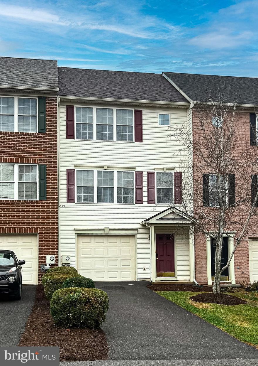 Welcome to 80 Ritter Drive in the popular Hammonds Mill community of Martinsburg. This well cared for three bedroom townhouse offers comfort, space, and convenience with more than 2000 square feet of finished living area. The main level features an open concept layout with hardwood flooring, a bright family room, and an inviting kitchen with granite countertops, center island, and table space. Upstairs you will find a spacious primary bedroom with a walk in closet and private bath along with two additional bedrooms and a second full bath. The finished lower level provides a flexible recreation area that can easily serve as a home office, media room, or playroom. This home also offers a one car garage. Located close to commuter routes, shopping, schools, and restaurants, this Martinsburg townhouse delivers easy living in a prime Eastern Panhandle location.