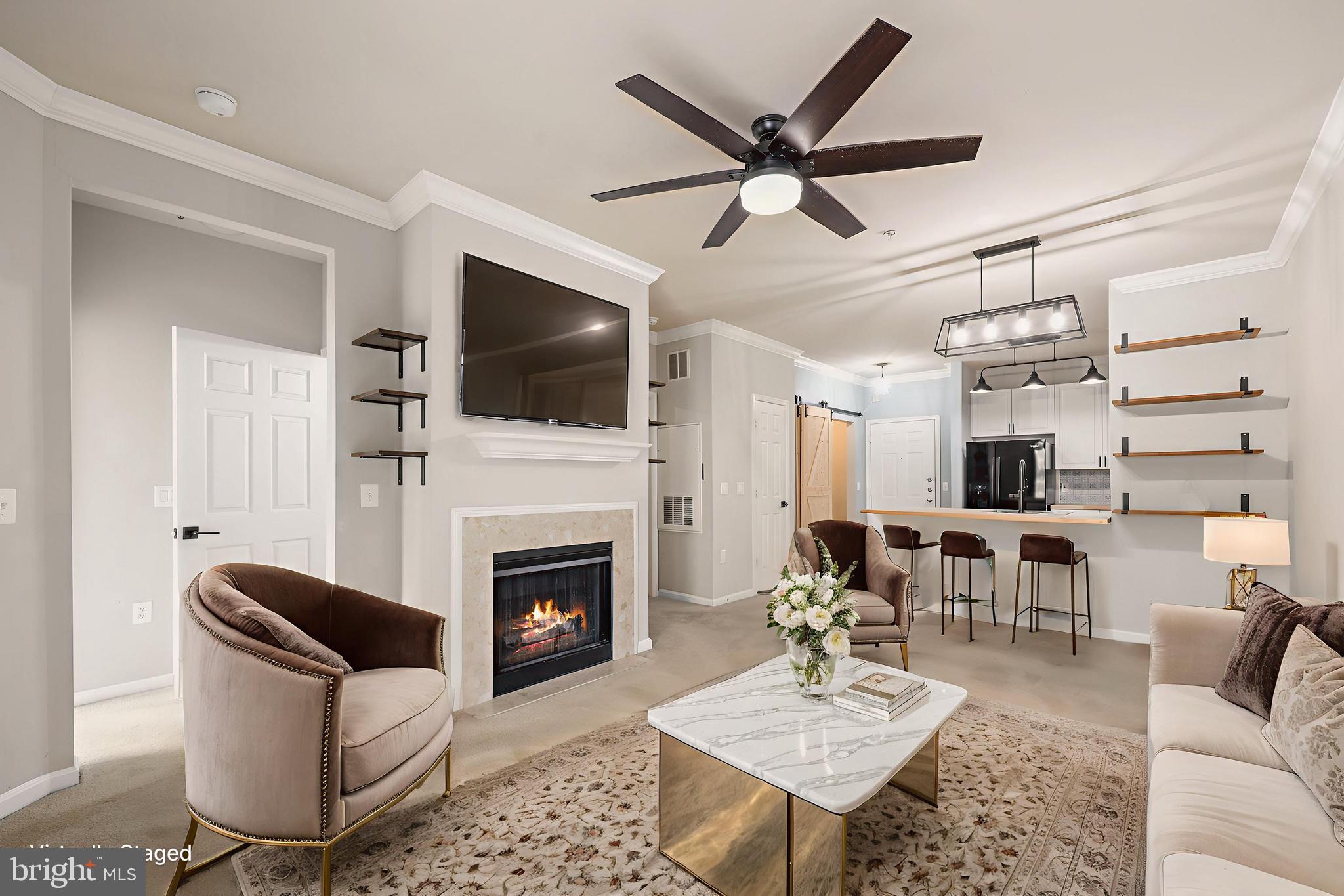 Welcome to 9480 Virginia Center Blvd #329—a beautifully updated and thoughtfully designed condo nestled in the heart of Vienna, where modern convenience meets everyday comfort.
From the moment you step inside, you're greeted by a sense of warmth and style. The updated kitchen is a true showstopper, boasting brand-new appliances (2023 & 2024), sleek countertops, an upgraded sink, refreshed cabinets, and contemporary lighting—perfect for morning coffee rituals or lively weekend entertaining.
The living space flows effortlessly, filled with natural light and complemented by new ceiling fans and lighting in both the living room and primary bedroom. Step outside to your private balcony overlooking the serene courtyard—an ideal retreat for quiet mornings or evening relaxation.
Every detail has been carefully considered to create a move-in-ready home: plush carpet and remodeled bathrooms (2021), energy-efficient washer and dryer, and a smart thermostat for year-round comfort and control.
The primary suite is a true oasis, featuring a beautifully renovated bathroom with a new soaking tub, modern vanity, and elegant tile work. Storage won’t be a concern—with custom built-in units and an updated laundry/mudroom that tucks everything neatly away while maximizing utility.
Two deeded garage spaces provide peace of mind and convenience, rounding out a home that blends style, functionality, and location.
Whether you're seeking a low-maintenance lifestyle or a welcoming space to grow into, this condo invites you to imagine not just living here—but truly feeling at home.