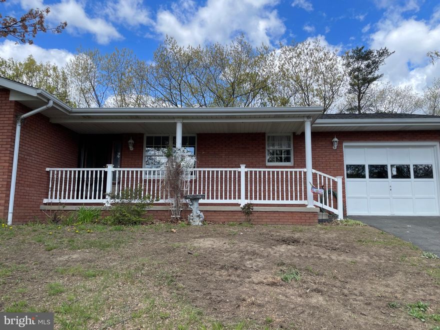 HURRY!  This 3 bedroom, 2 bath brick ranch has just been freshly painted and received a new stove and some new lighting fixtures. ! All other appliances convey. You will LOVE the vaulted ceiling and fireplace in the spacious living room that opens on to the rear deck! Nice yard of .40 acres here! Great WV  mountain views and low WV property taxes. Located in the newer section of Knobley Estates, this home also features a HUGE rec room on the lower level with a woodburning stove for those cold winter nights! A must see!