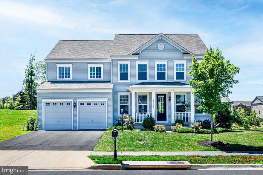 Modern Farmhouse Chic Stanley Martin "Carey" model in the Villages of Piedmont II only 5 years young. Property sited on premium .25 acre lot privately backing to the walking trail and trees.  This open floor plan contains 4,839 sq ft of living space (4,641 sq ft finished on 3 levels) w/ 5 BRs (incl Owner's Suite w/ 20' x 10' ensuite sitting room), 4.5 BAs, 2-car garage and upstairs laundry room. Natural light abounds on Main level with windows on every wall highlighting the rustic plank hardwood floors and crown molding + ceiling speaker system. The Gourmet Kitchen features a gas cooking range & walls of antique white cabinets on three sides surrounding a massive central island with more storage below. Upgrades include recessed lighting, a white subway backsplash & 2 mud rooms + a walk-in pantry. A 12' x 17' Breakfast Room overlooks a sliding atrium door for a future deck / patio. Relax in Family Room in front of the fireplace, host a dinner part in the Dining Room or escape through the glass French doors into your private home office for telework and virtual meetings. Upstairs features 4 BRs & 3 Full BAs (2 ensuite) + Laundry Room. Retreat into the Owner's Suite "wing" w/ Sitting Room, Tray Ceiling & 2 massive Walk-In Closets + ensuite full bath w/ Double Sink Vanity, Walk-In Shower & Jacuzzi Tub. Finished, 1,500 sq ft Walkout Basement features an open Rec Room with high ceilings, wet bar, grandiose 5th BR (21' x 13') w/ walk-in closet & 4th Full Bath + bonus Den that could be setup as a Theater or Exercise Room. Enjoy the country club-style amenities Villages of Piedmont II has to offer w/ a very low HOA $120/monthly: 7 miles of walking trails, two swimming pools, two community centers, multiple tot lots + a large playground, a dog park + sport courts for tennis, basketball & volleyball. Old Town Haymarket + local shops and restaurants within 1 mile & convenient commuter access.