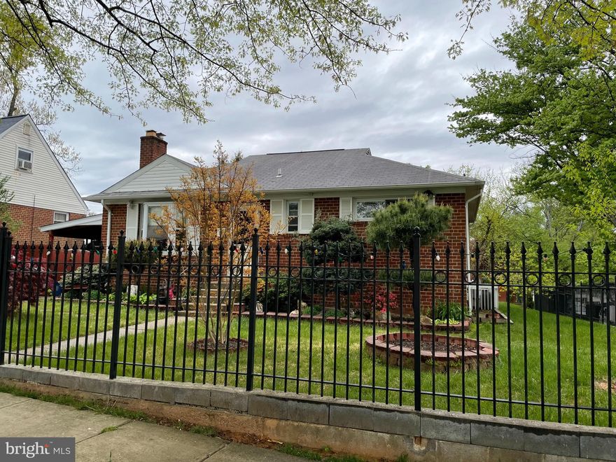 Fantastic brick single family home with 4 bedrooms and 2 full baths.  Home sits on the best lot in the neighborhood,  completely square, large, and fully fenced with iron railings.  The main level features well-maintained hardwood floors throughout.  Family room has wood burning fireplace, separate dining room and living room. Living room area used to be a bedroom and new owner can convert back if large living room space is not needed. Huge sunroom with floor heating. The backyard is a gardeners dream with mature, fruiting trees.