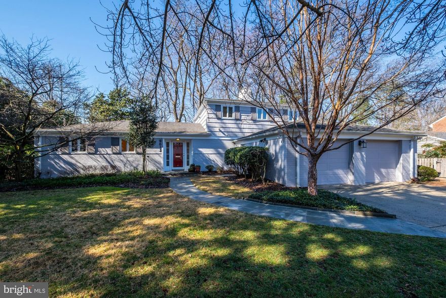 A very special offering in Rock Creek Hills. Tucked back off the street on a .43-acre lot adorned with specimen trees and flowering shrubs, this move-in ready home offers wonderfully versatile space suited to any life stage. An abundance of windows permit ample natural light which accentuates the golden hardwood floors. Affording picturesque views from nearly every room, main level highlights include an owner's bedroom suite with a renovated bath, a large living room with built-ins and a fireplace, a phenomenal family/great room with coved cathedral ceiling and walls of glass, a separate central dining room, a beautifully renovated custom kitchen with delightful breakfast area featuring vaulted ceiling and skylights, an office/additional bedroom, a renovated powder room, and a laundry room. On the upper level are two spacious, private bedrooms with two closets each, a full hall bathroom with a vanity desk, and a walk-in storage closet​. The large lower level offers open recreation and game rooms, the second fireplace, a side entrance to a bedroom suite which features a renovated bathroom, a walk-in closet, and an adjacent sitting room/office, and a utility room for additional storage and function. Outside, the magnificent grounds consist of a private rear yard with child's play-set, lovely brick patios, and stone walkways and accent walls. A generator, an oversized 2-car garage, and an attached storage shed complete the exterior amenities. Just off Kensington Parkway near Rock Creek, in the Bethesda-Chevy Chase school district, and moments to downtown Kensington's shops, restaurants, and the train station, this location has it all. Welcome to your forever home!